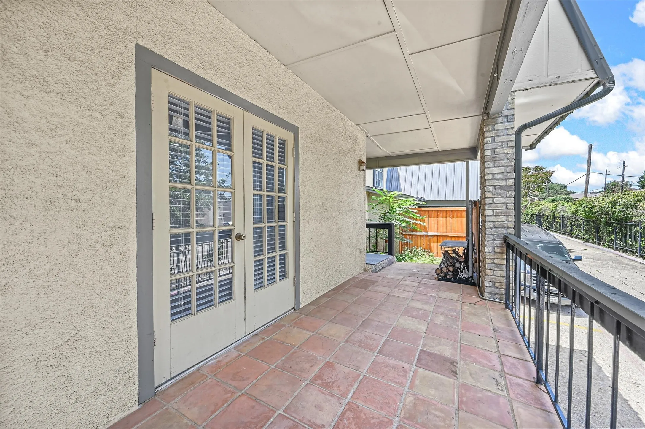 View of patio featuring a balcony
