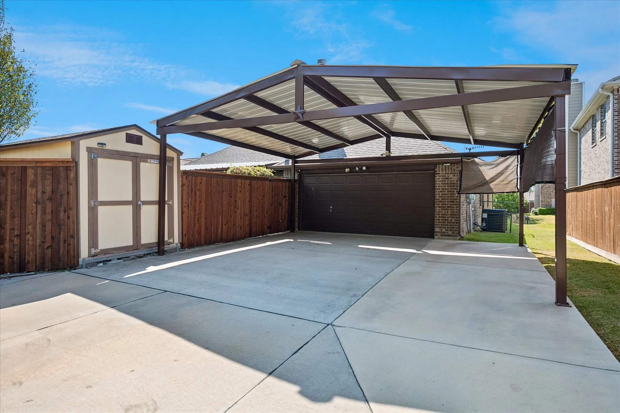 Carport plus 2 Car Garage. Storage shed. Extended drive way.