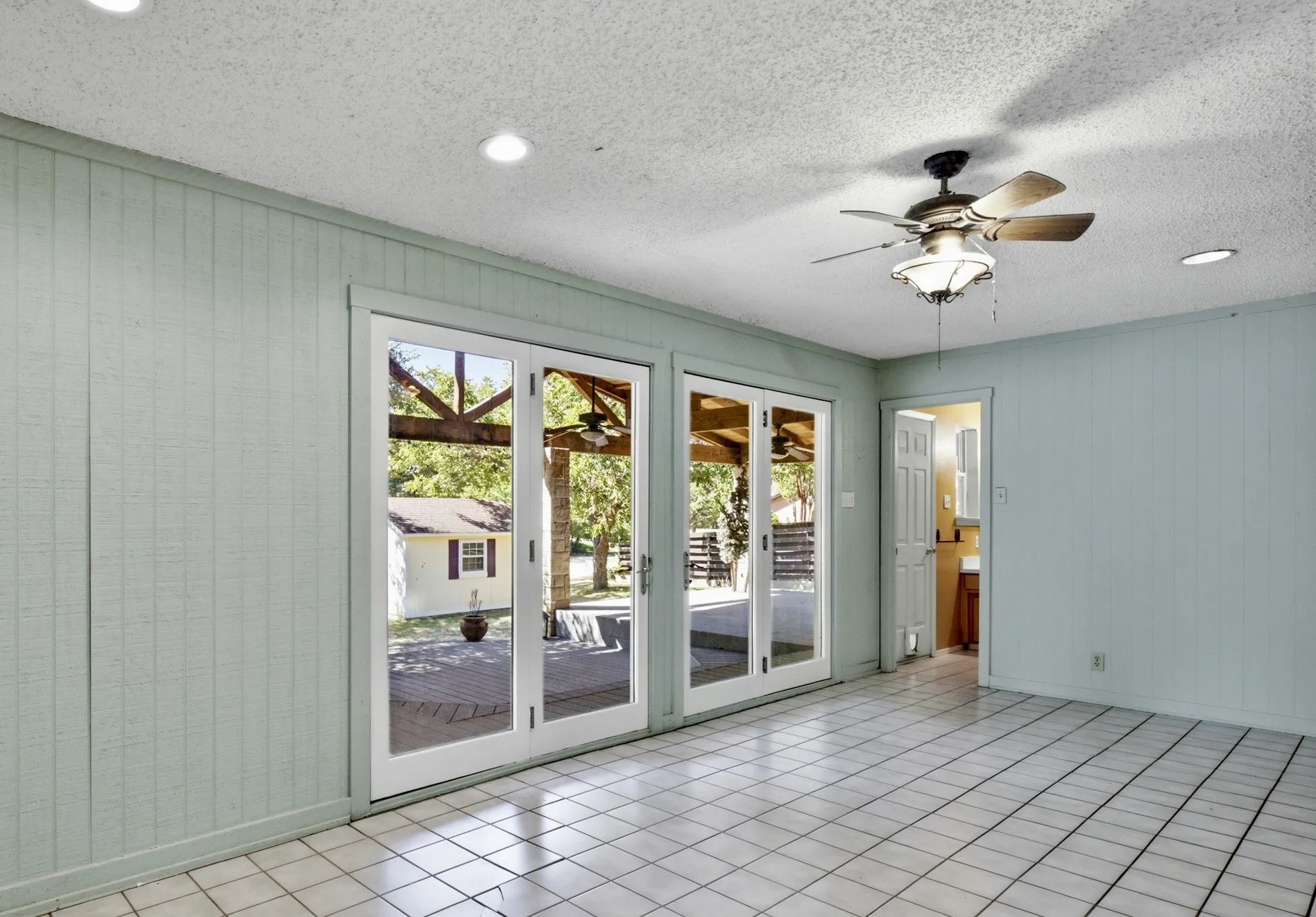 Sunroom with french doors to patio & yard