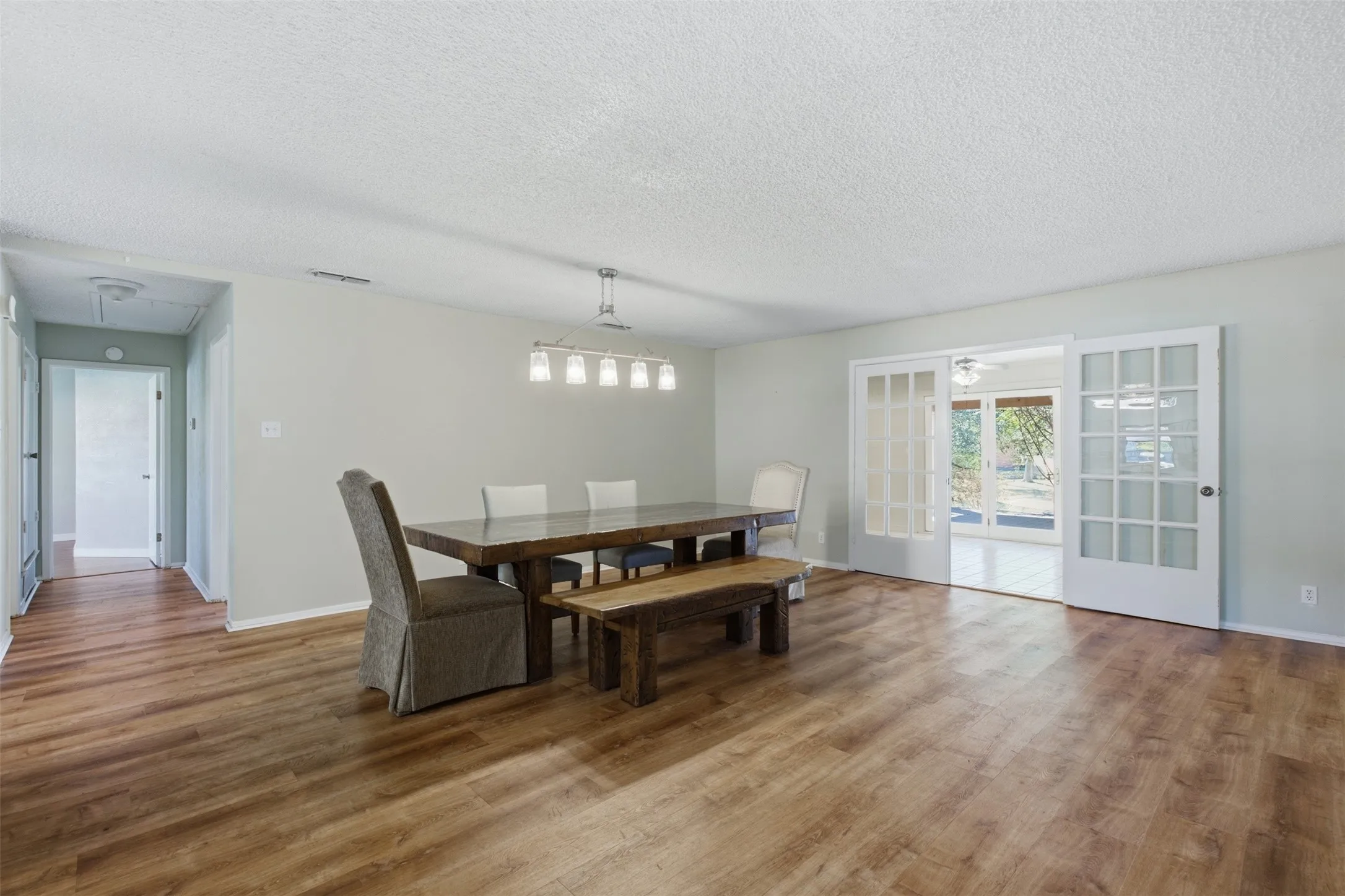 Dining features luxury vinyl wood-look floors
