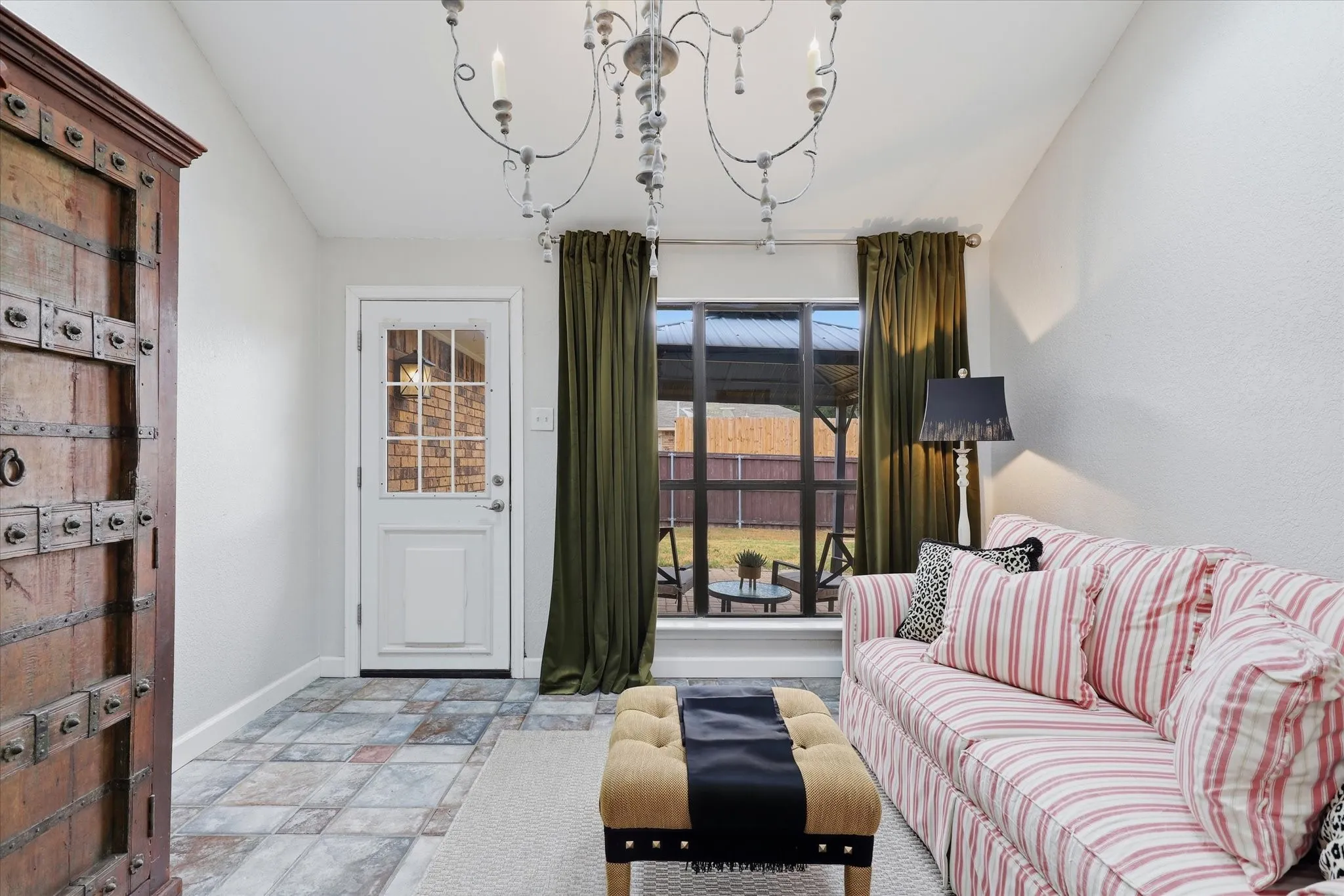 Charming sunroom provides additional living space with backyard access—perfect for a sitting room, playroom or home office.
