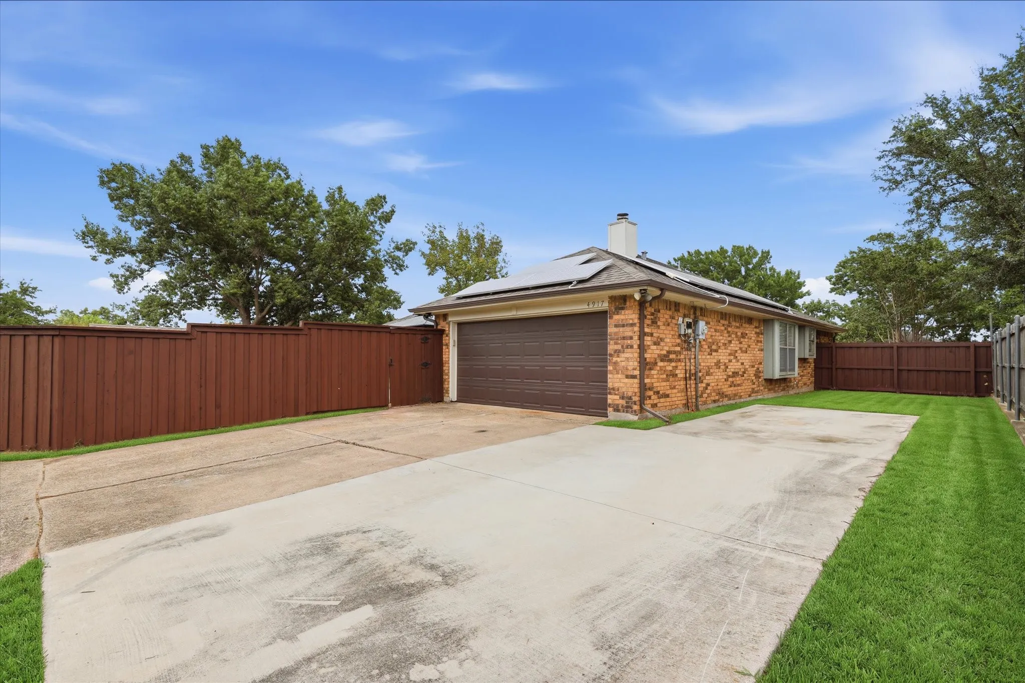 Oversized rear driveway provides exceptional additional parking with space to accommodate a boat, trailer or RV.
