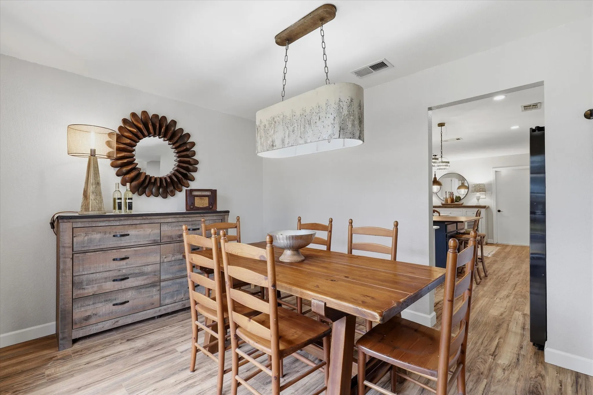 Another view of the dining room highlights the generous proportions and seamless connection to the kitchen.