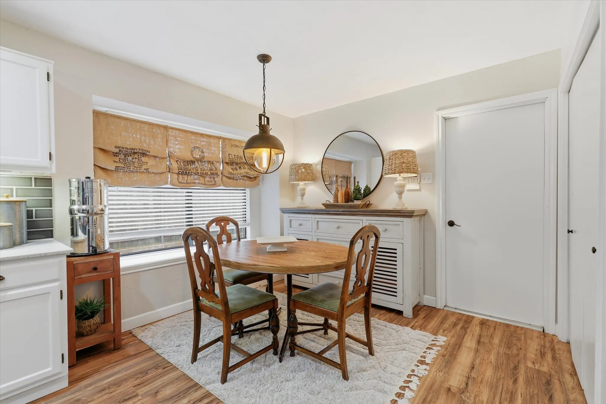 Light-filled breakfast area with a large picture window and easy flow into the kitchen.