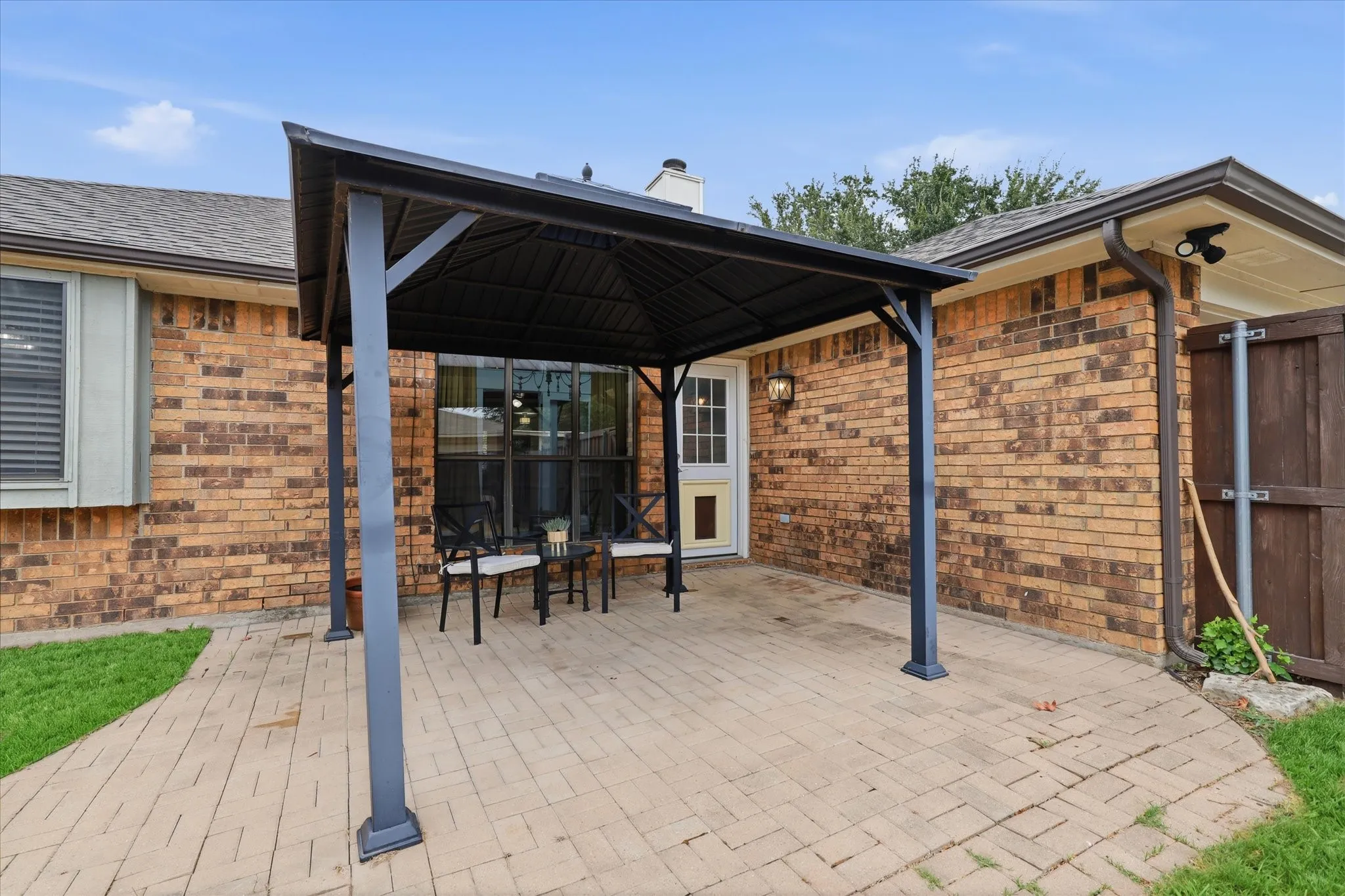 Covered patio extends the living space outdoors and offers a comfortable spot for dining, relaxing or entertaining.