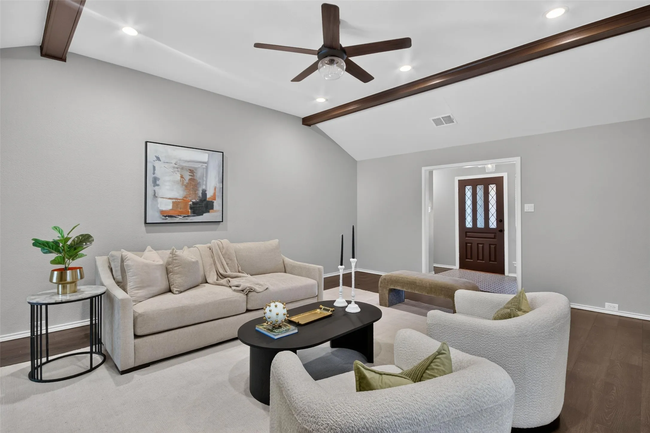 Vaulted ceiling with exposed wood beams, recessed lighting, and a ceiling fan
