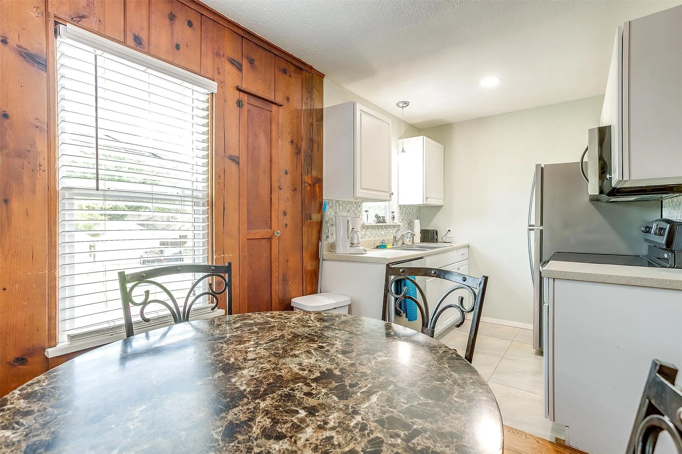 Dining area overlooks the kitchen