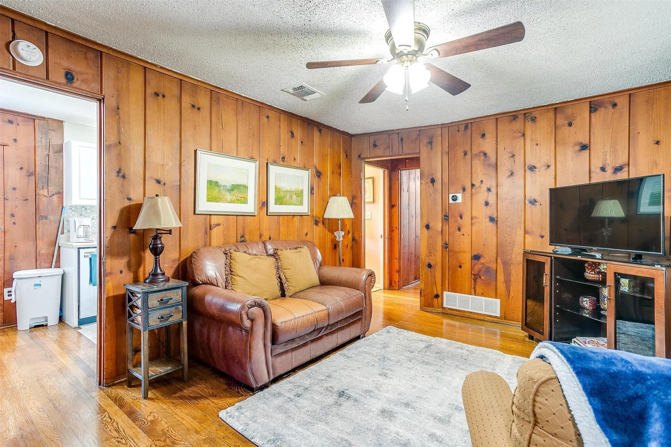 Garage apt w/ low maintenance Wood-paneled walls with wood-finish flooring