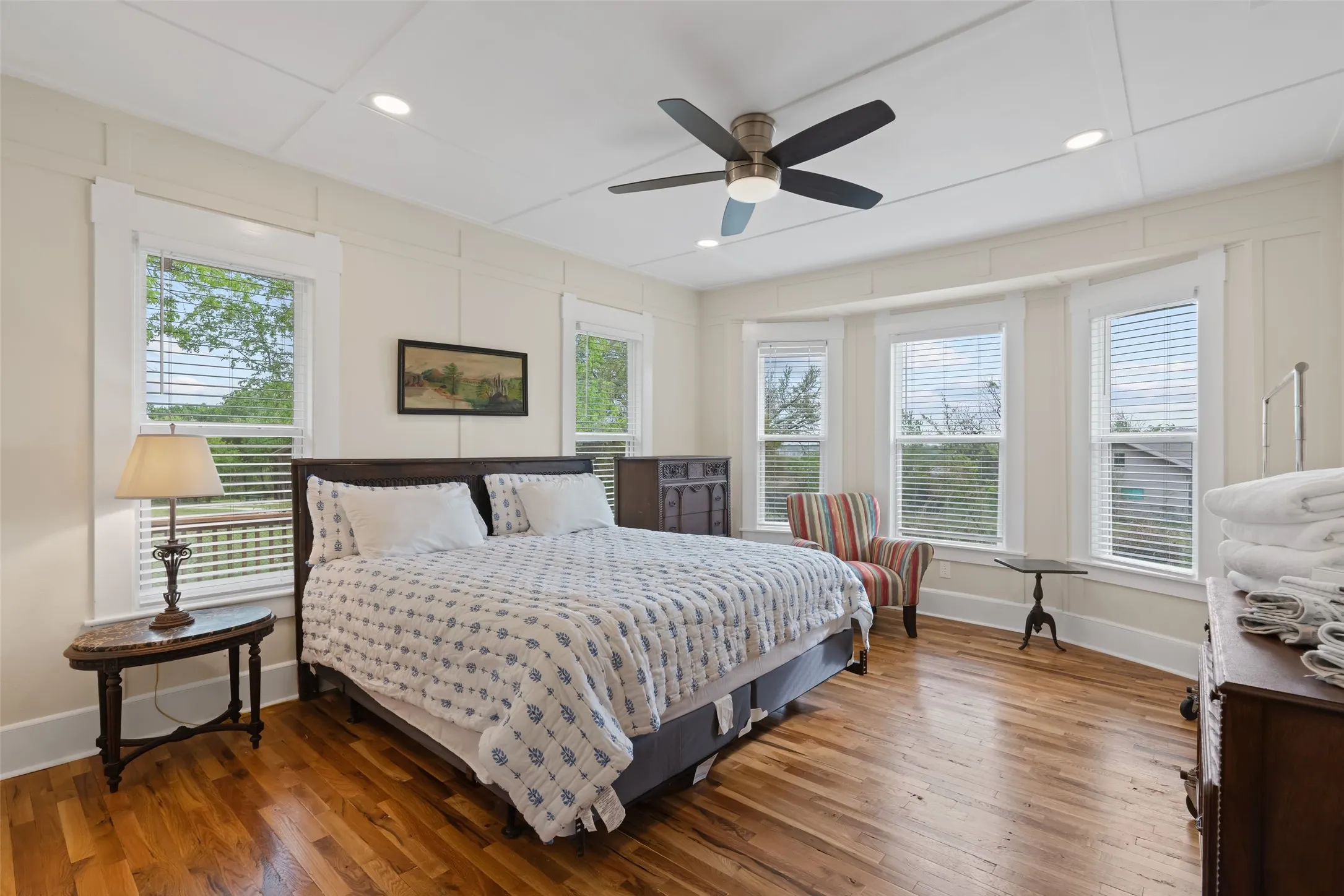 Spacious primary suite with hardwood floors & natural light.