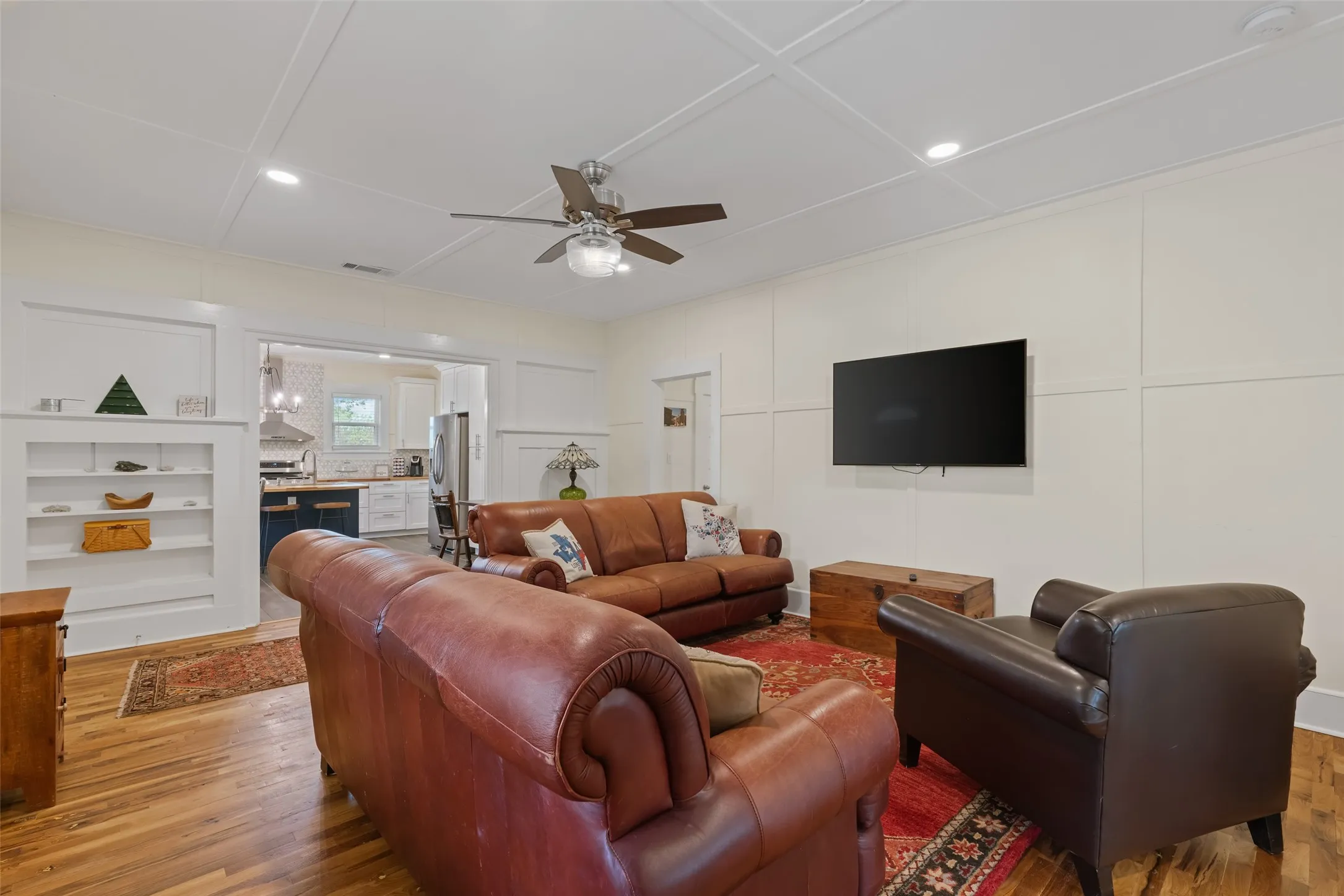 Spacious living room with hardwood floors & abundant natural light.
