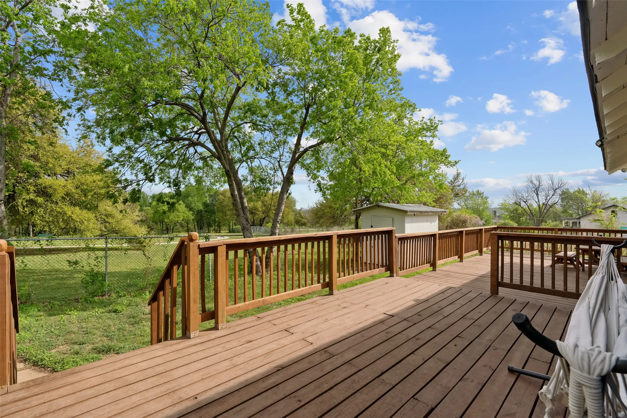 Expansive rear deck overlooking Traders Oak Park.