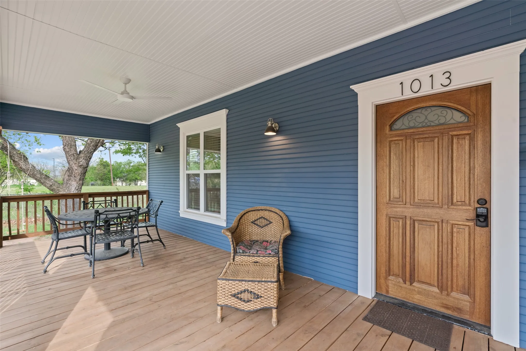 Deep, covered front porch with classic Craftsman character.