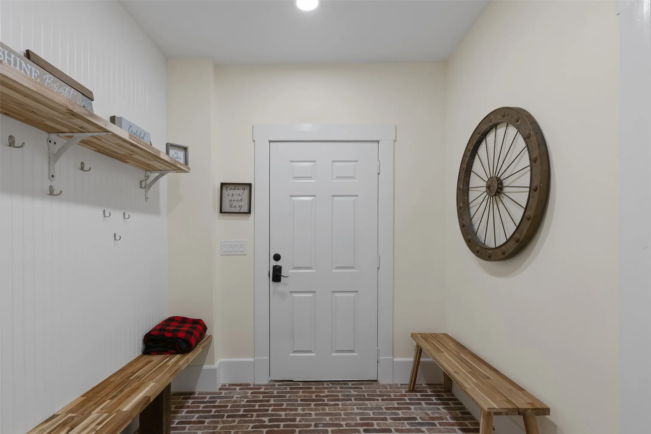 Convenient mudroom with built-in storage & access to the rear deck.