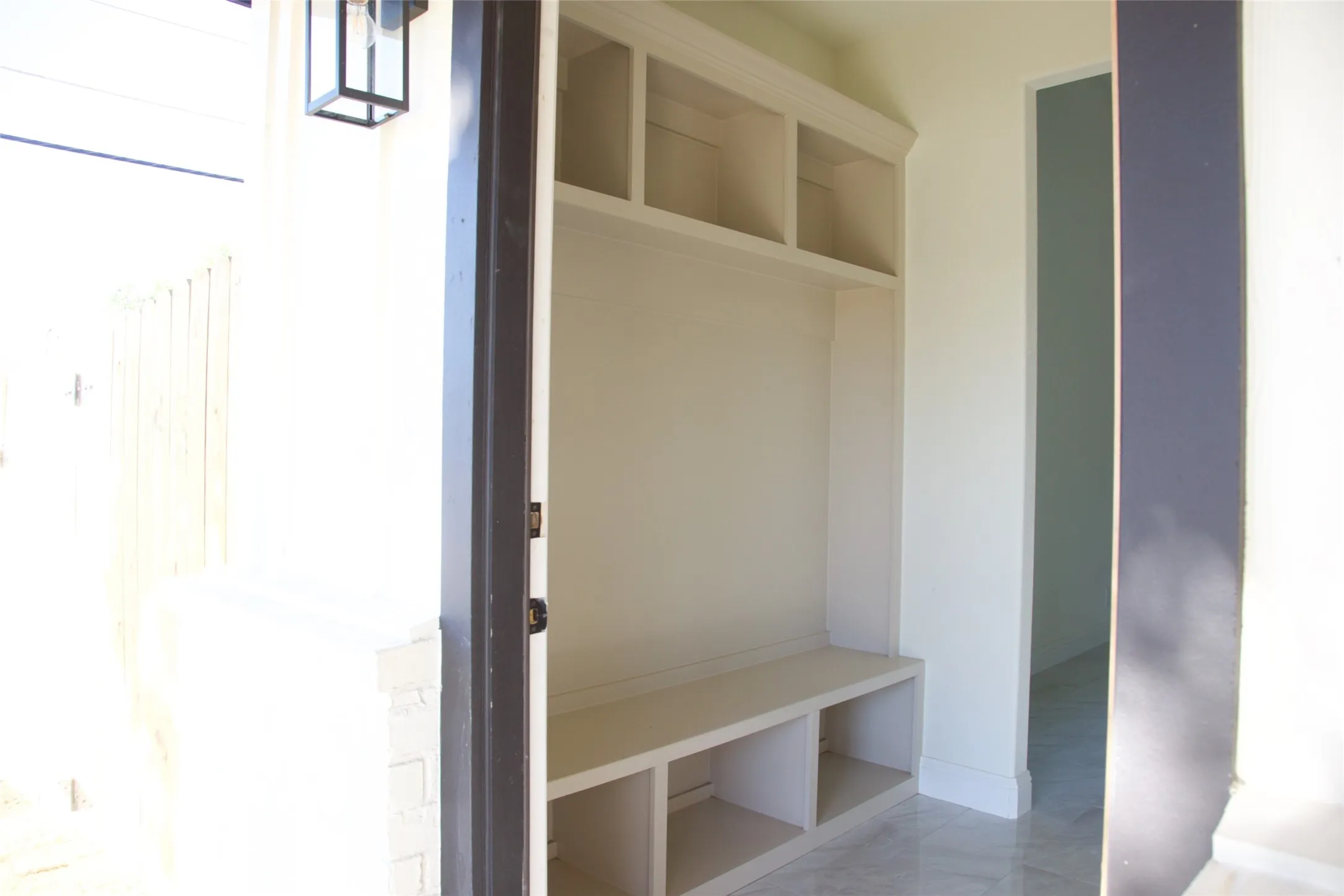 Built-in storage bench with overhead shelving