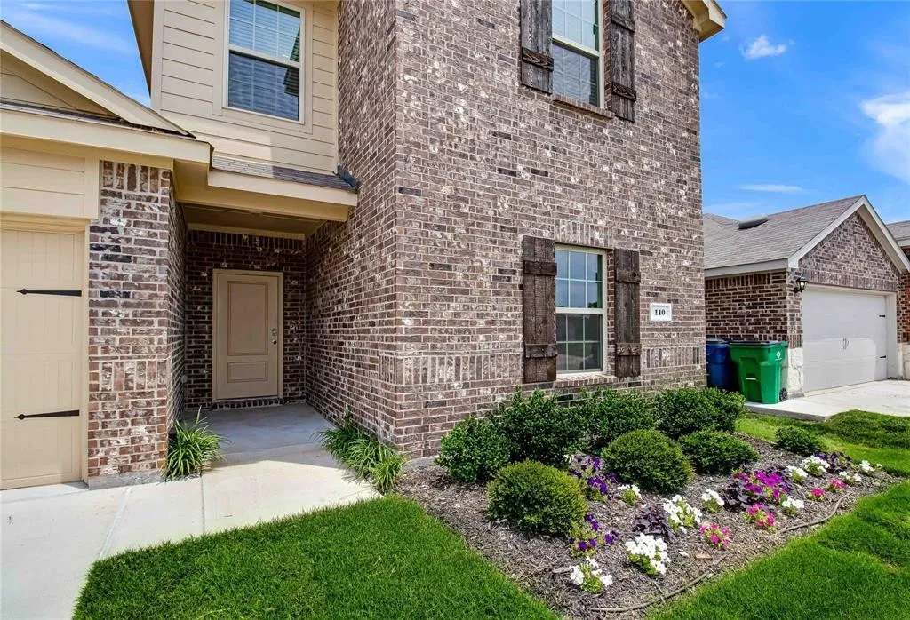 View of exterior entry featuring a garage