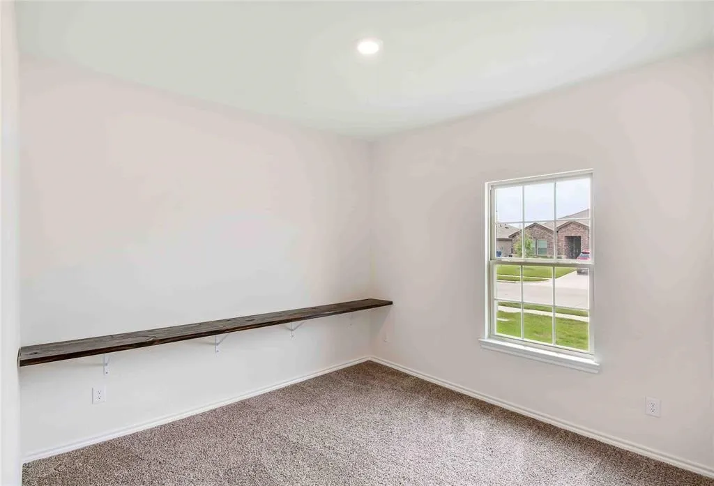 Unfurnished room featuring carpet