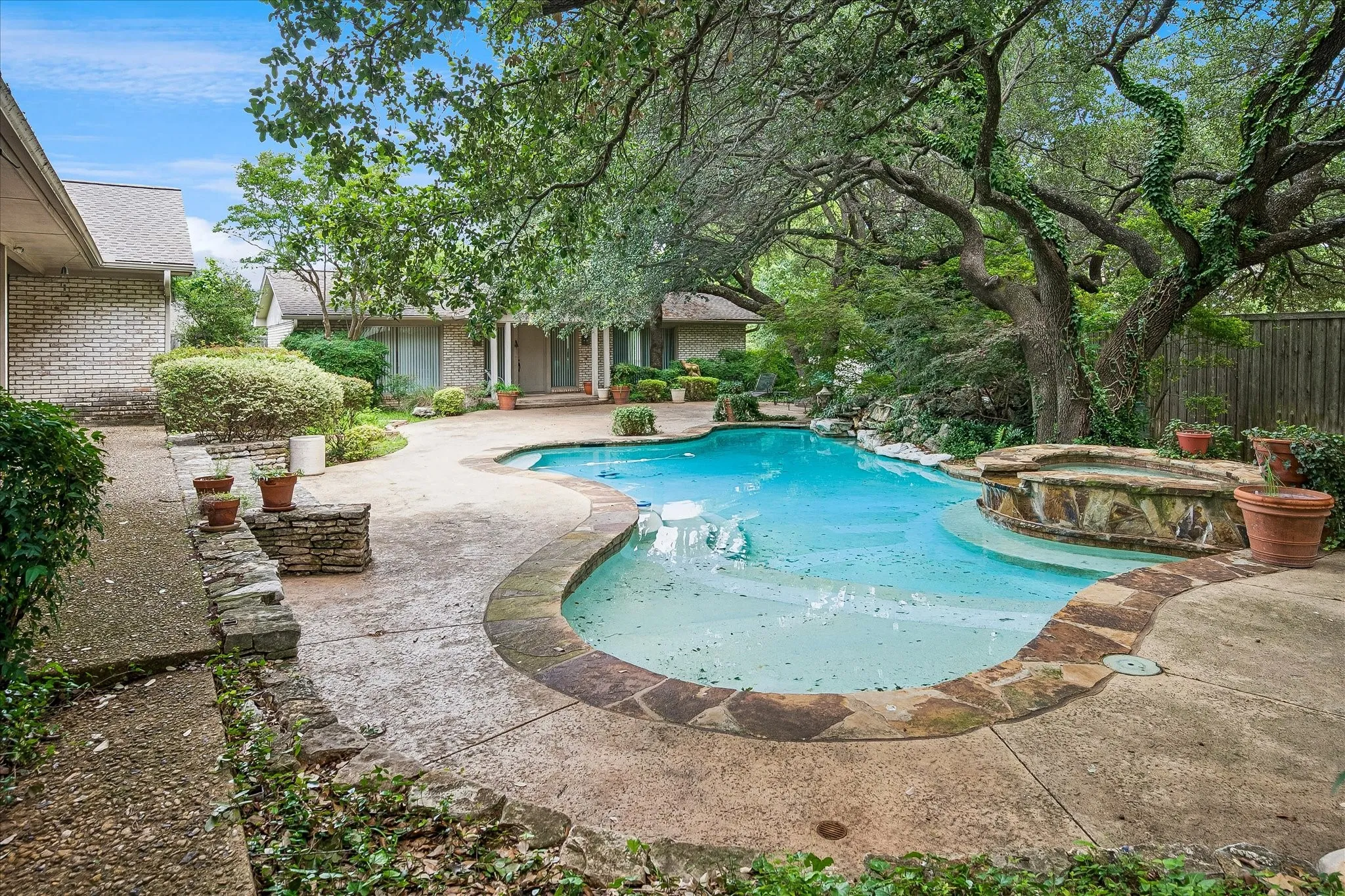 Pool and spa across backyard