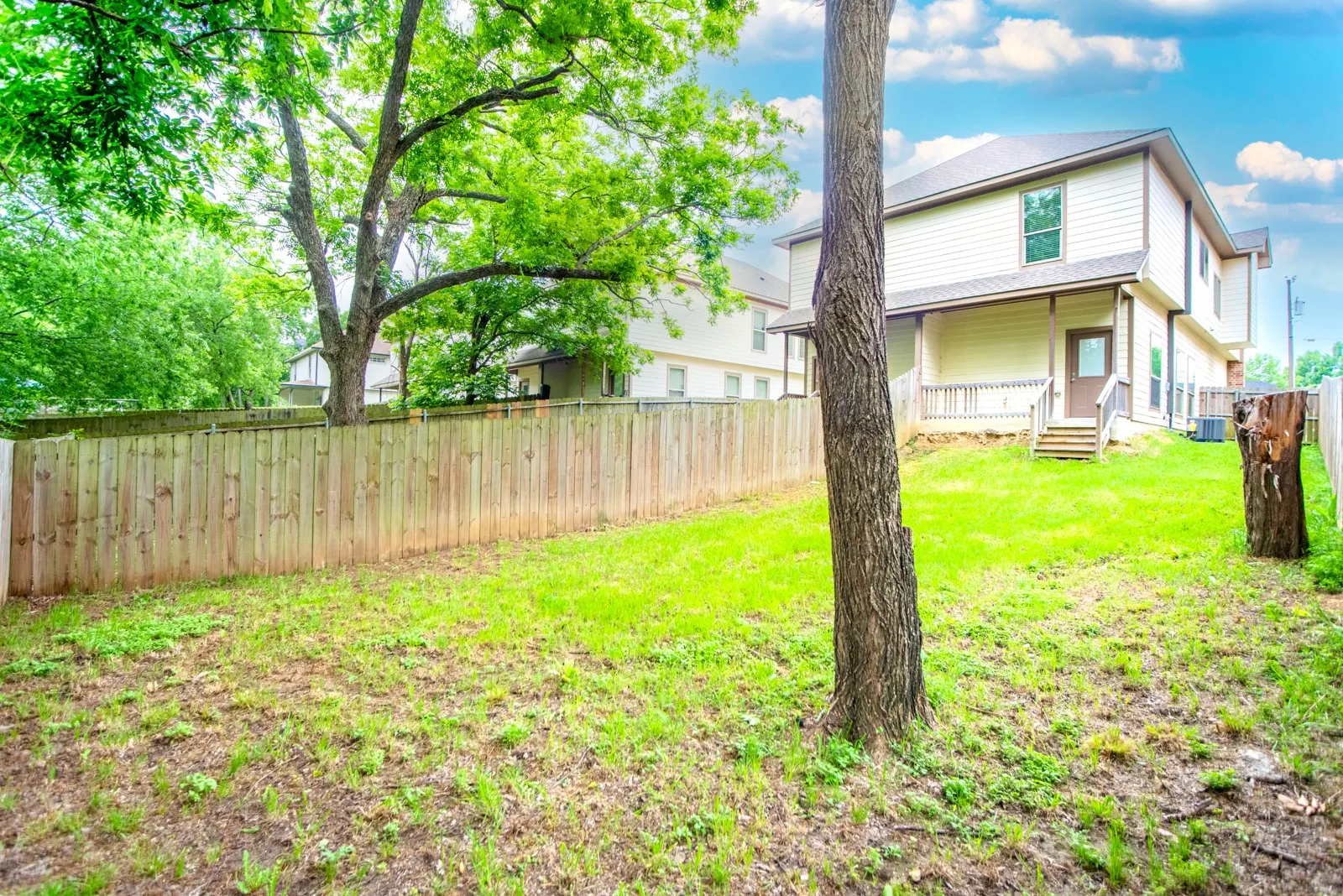 Expansive backyard with a full privacy fence