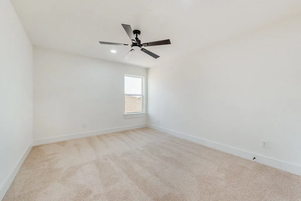 Carpeted flooring, single window, sloped ceiling, recessed lighting, and ceiling fan