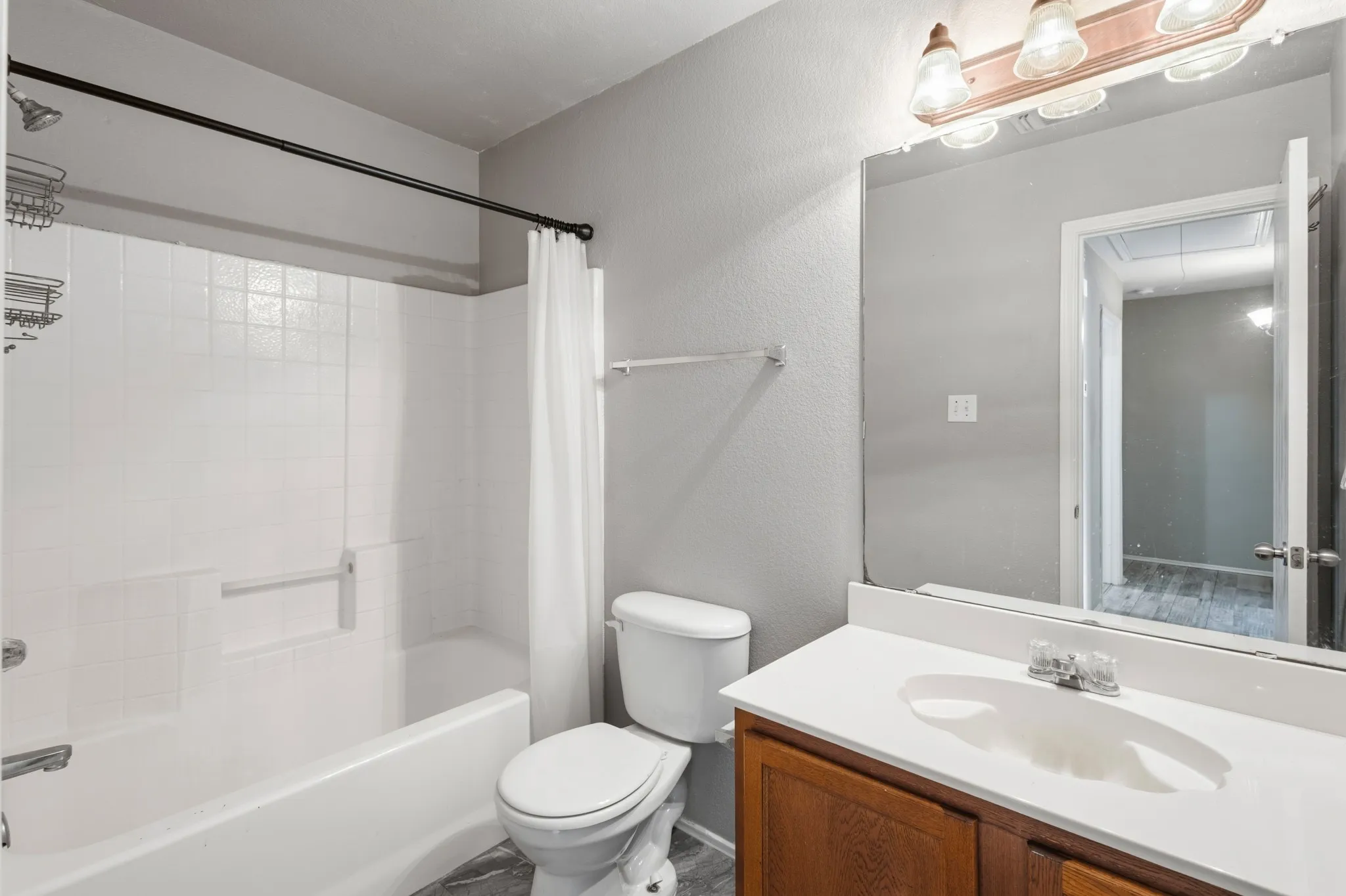 White tile shower surround with a built-in tub