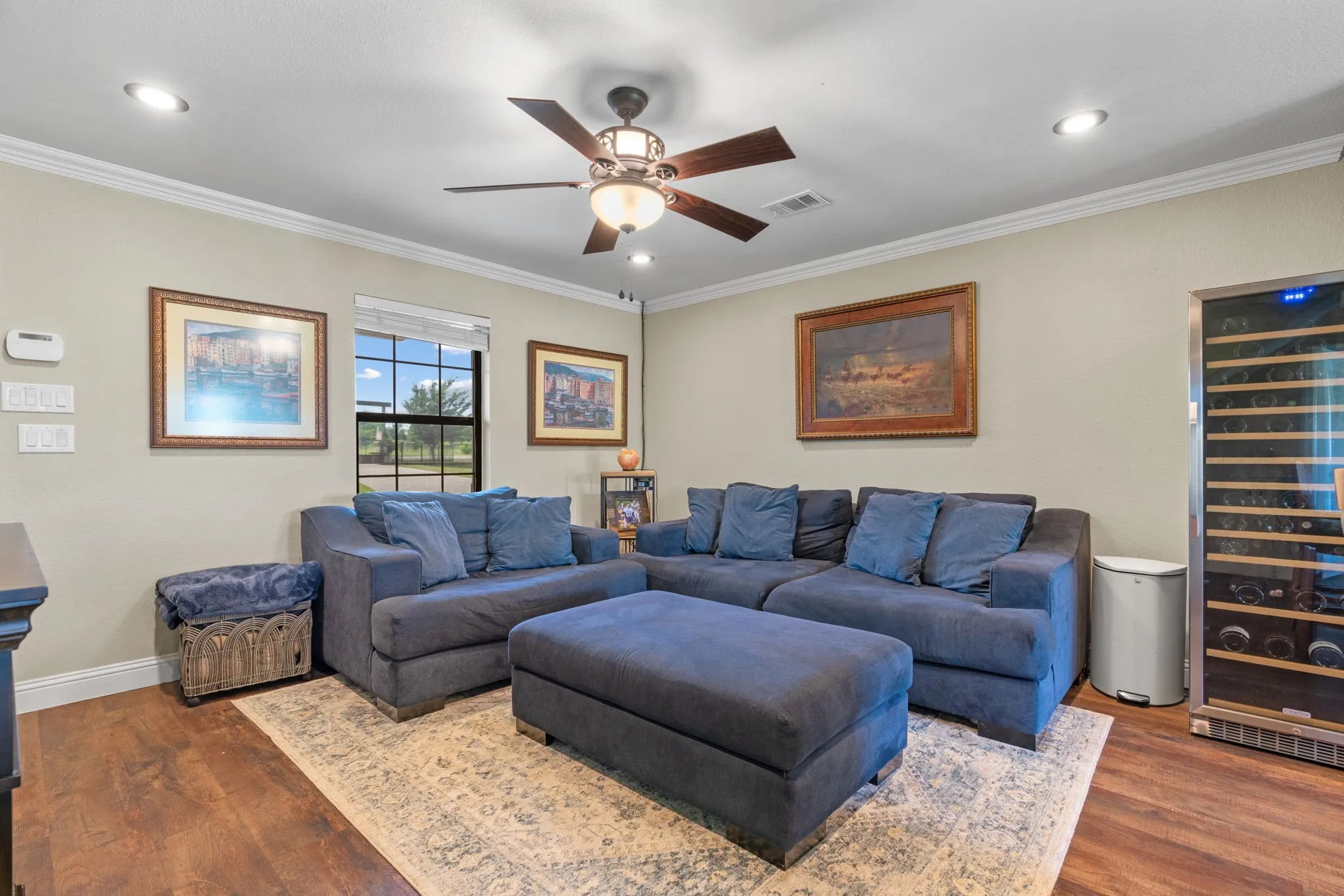 GUEST HOUSE! Wood-finish flooring, recessed lighting, crown molding, ceiling fan with light fixture, and a built-in wine refrigeration unit