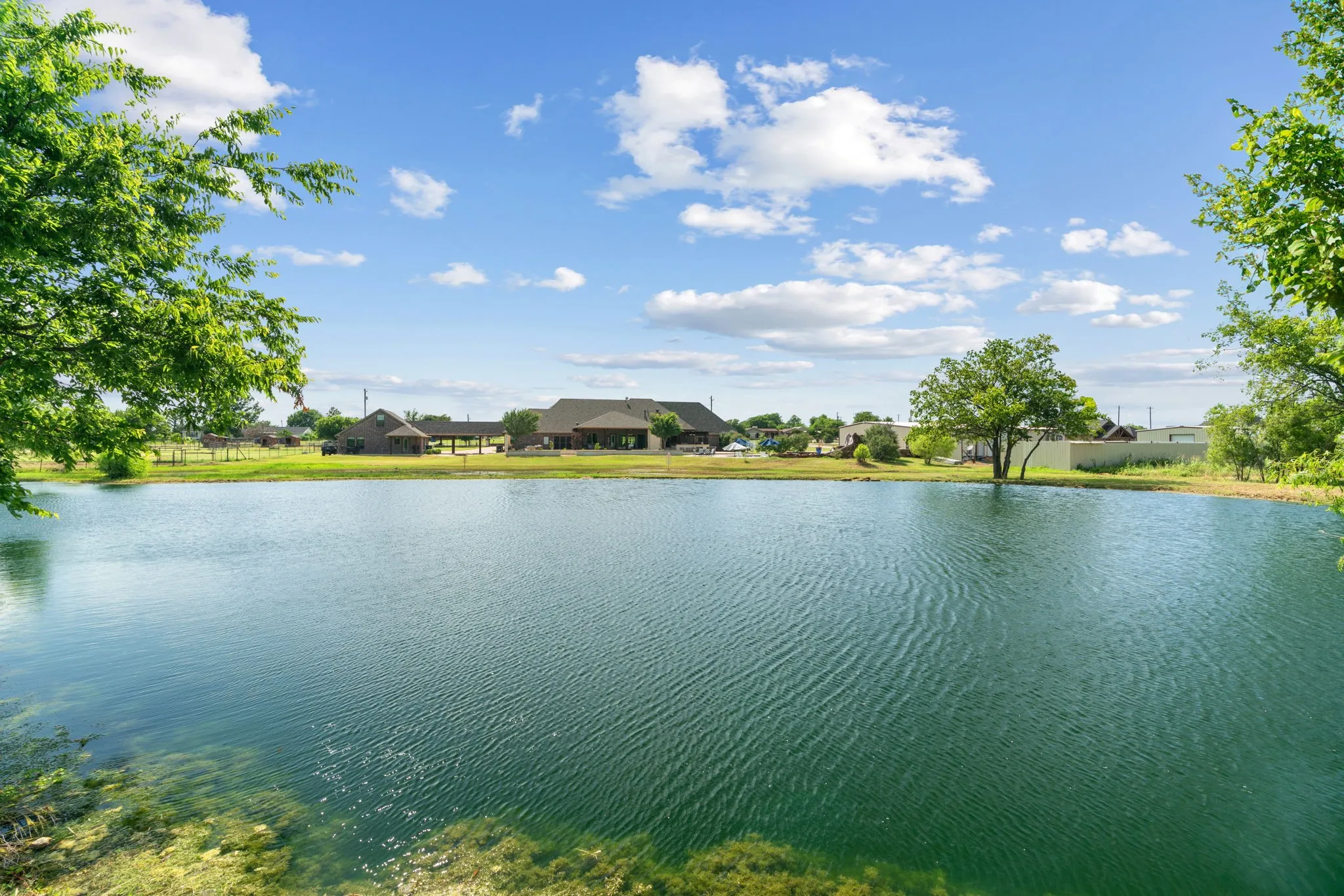 Expansive private pond with a natural shoreline