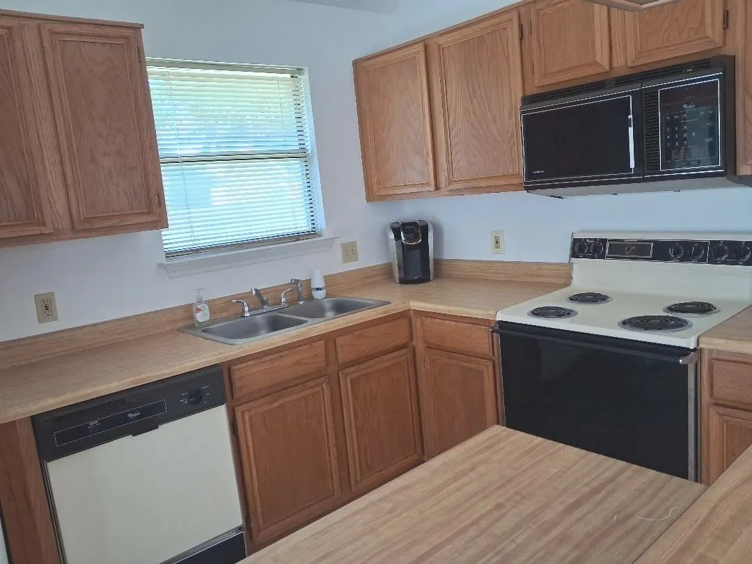 PLENTY OF CABINETS, COUNTER TOPS, AND A PANTRY TOO