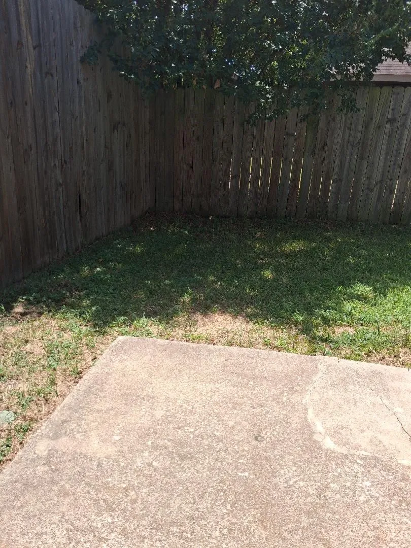 BACK YARD DOES HAVE A FENCE AND A PATIO