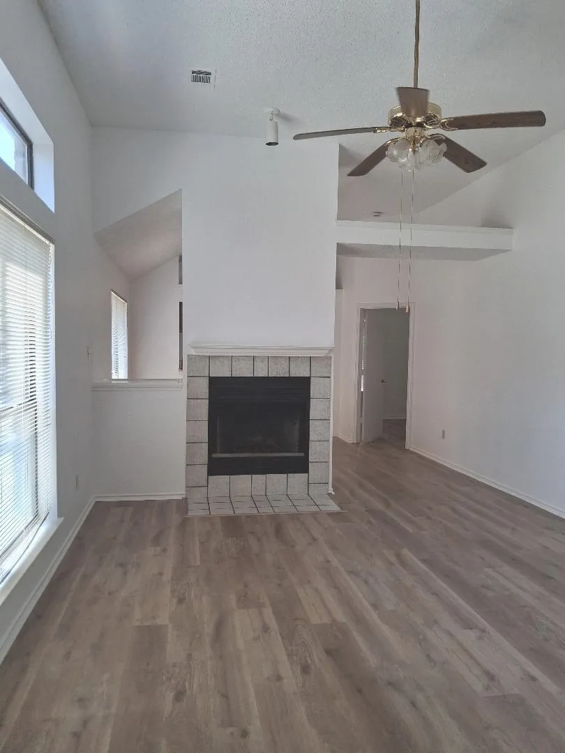 SPACIOUS GREAT ROOM THAT IS LIGHT & BRIGHT WITH WOODBURNING FIREPLACE