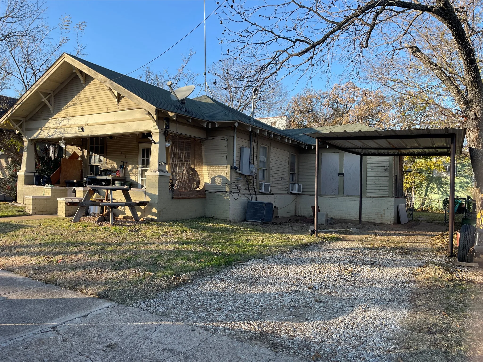 Large front porch, detached carport; photo taken when occupied