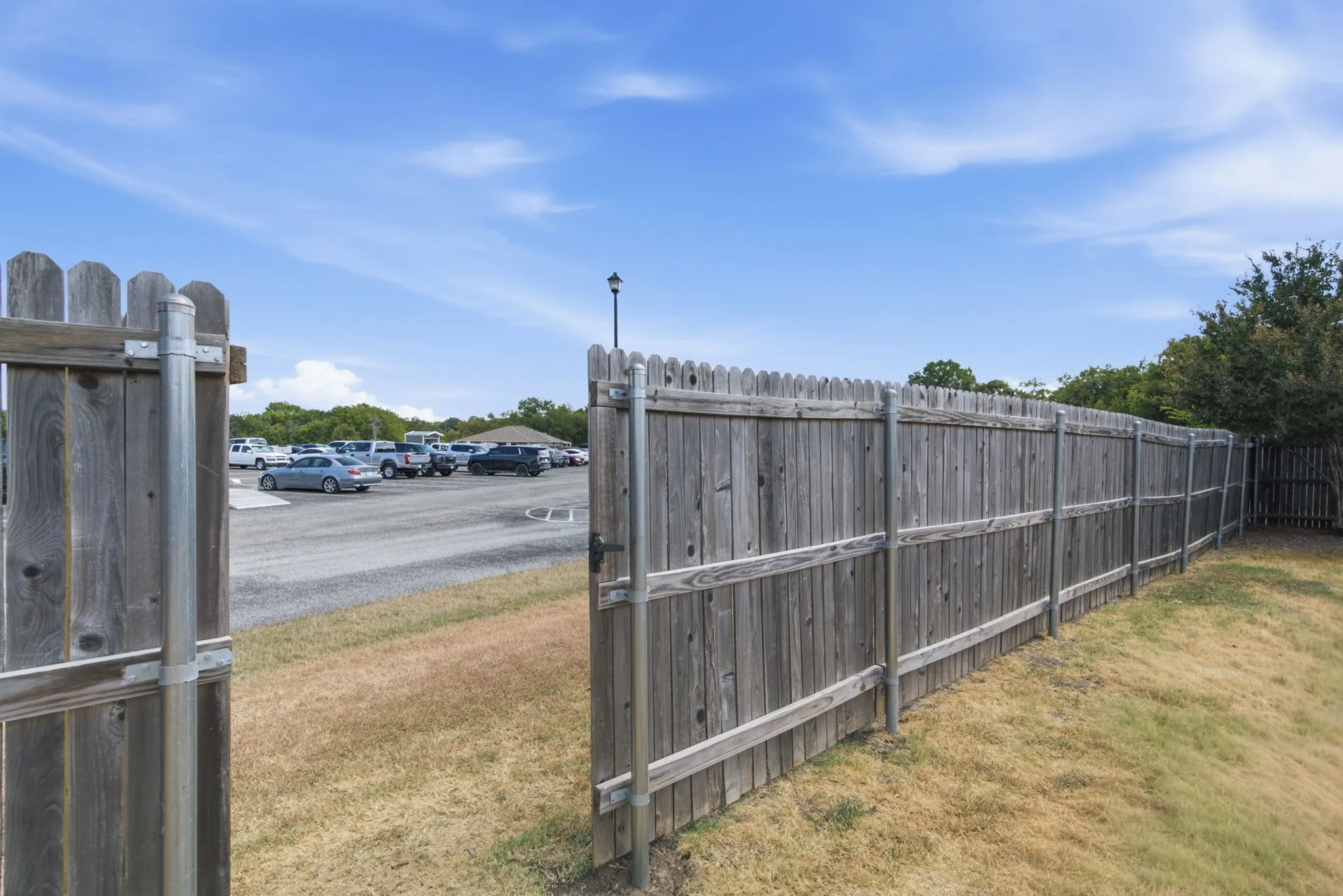 Backyard gate to Cross Timber Country Club parking lot.
