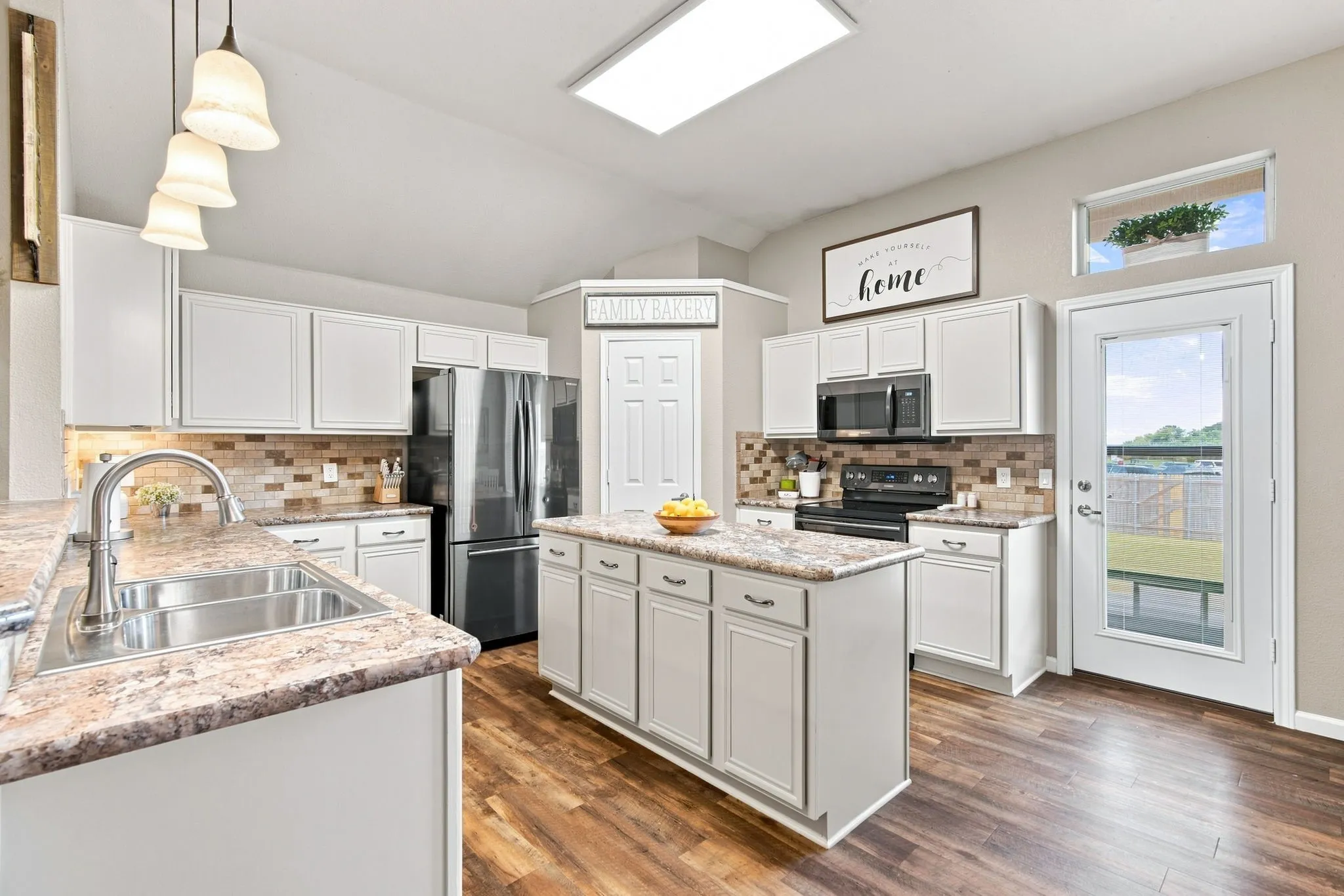 Large kitchen with an abundance of counter space and cabinets!
