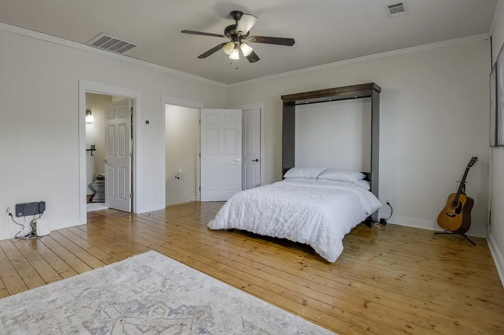 Wood-finish flooring, ceiling fan, and built-in Murphy bed