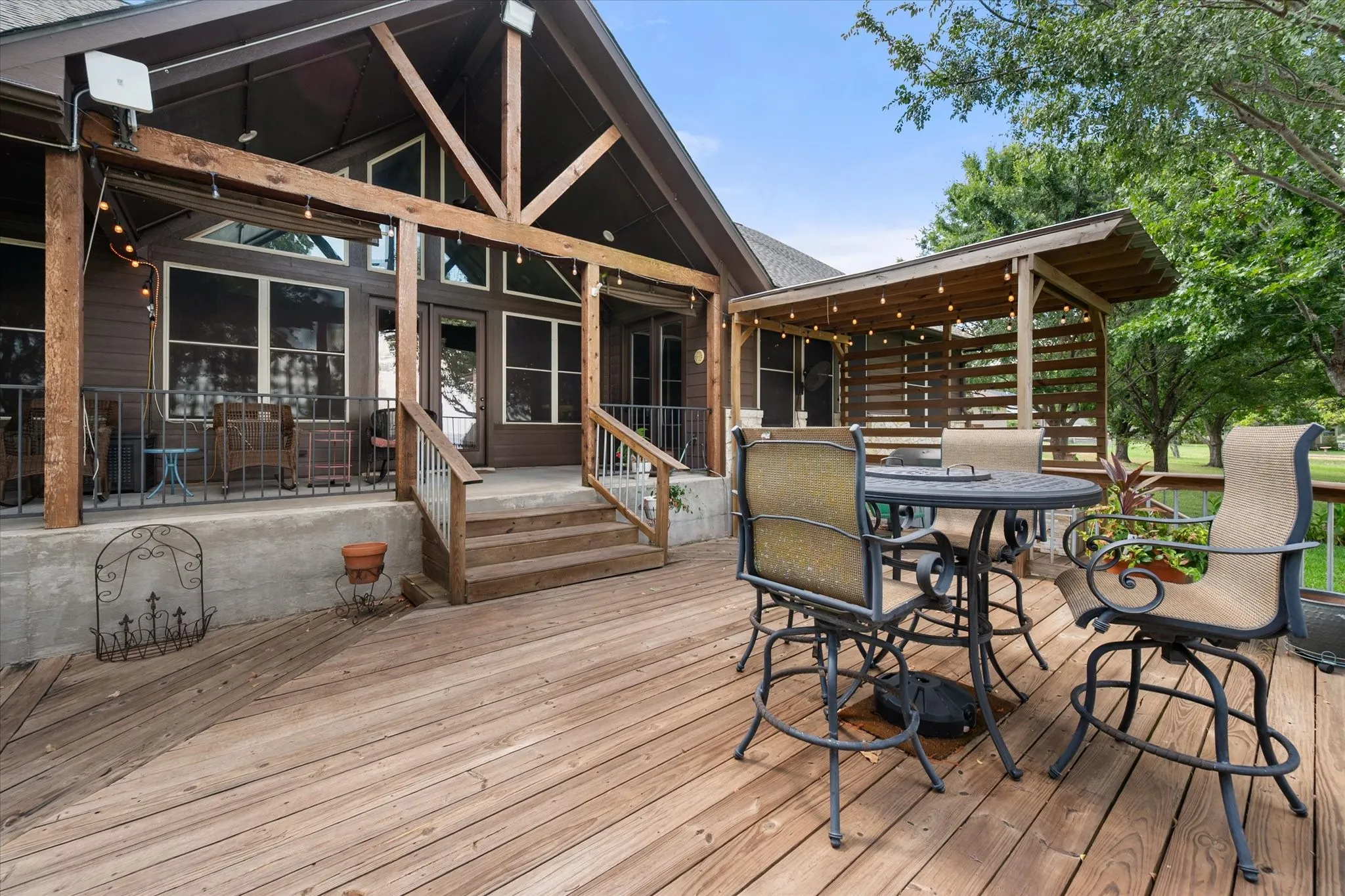 Covered porch offers a comfortable, protected outdoor retreat for relaxing and enjoying the peaceful waterfront surroundings.