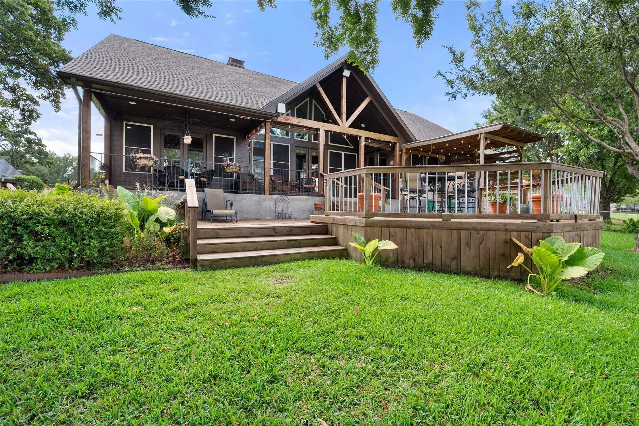 Expansive covered and open deck areas provide multiple places for outdoor dining, entertaining, and enjoying the lake lifestyle.