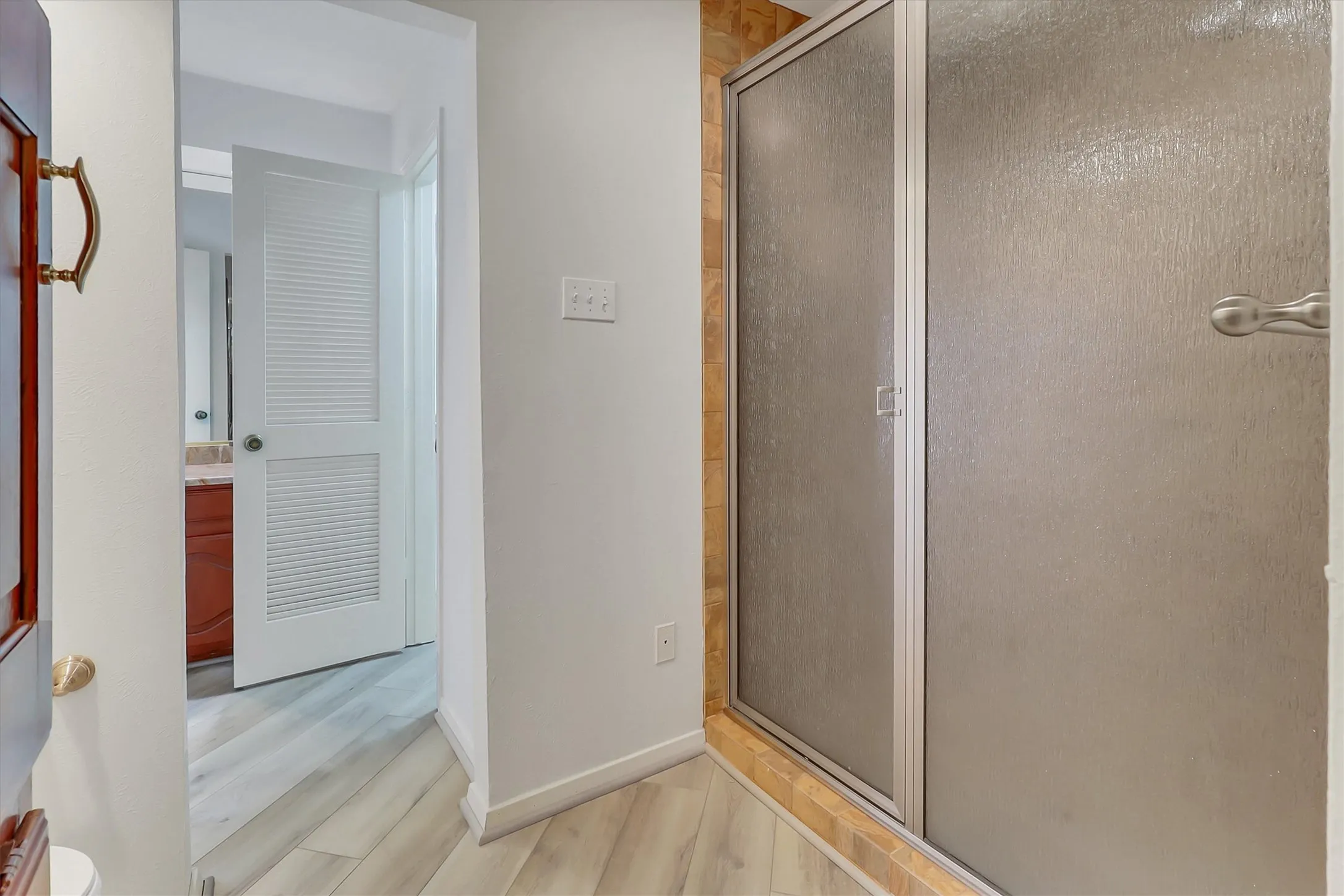 Large shower with tile from ceiling to floor