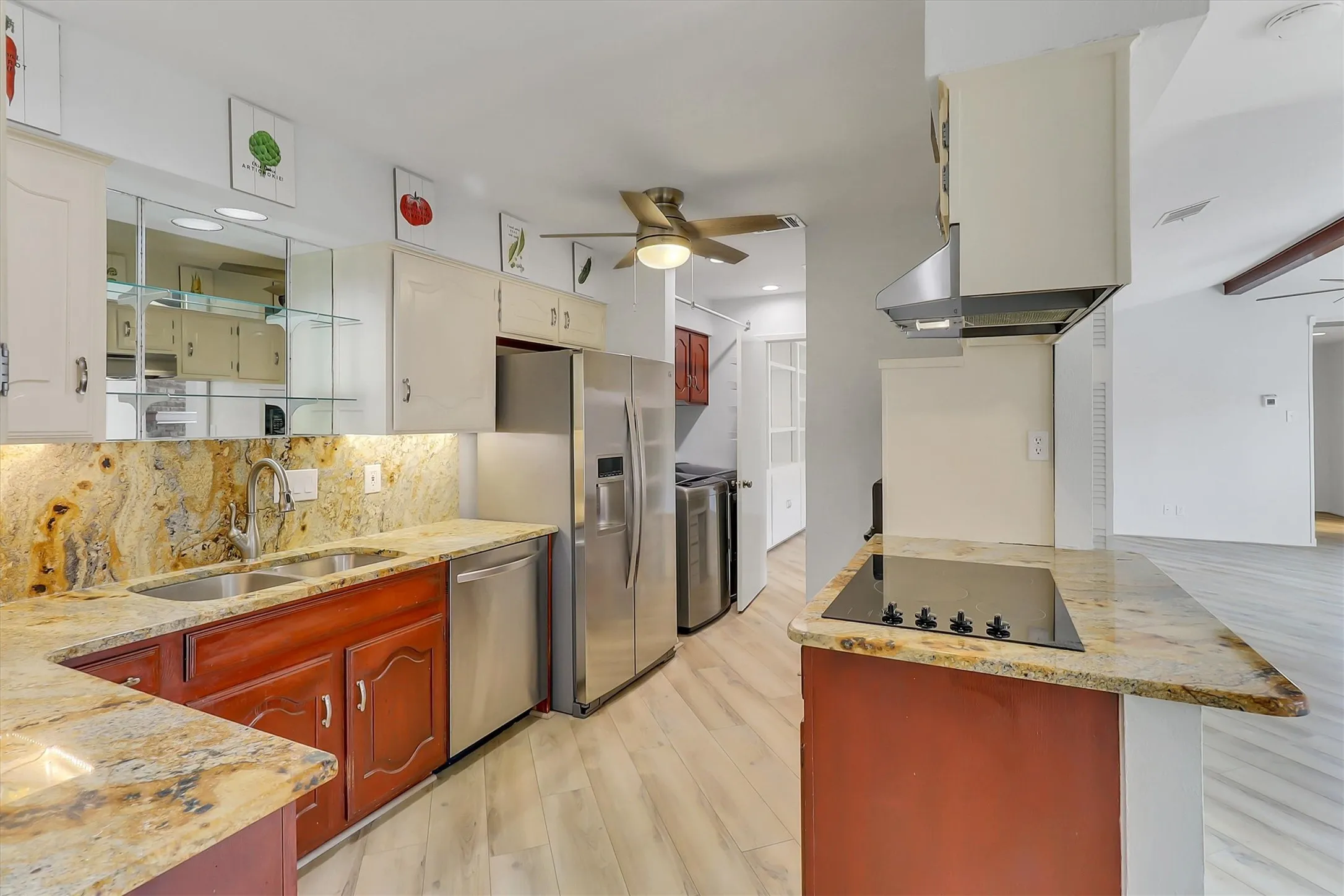 Granite countertops, ceiling fan, electric stove, dishwasher and the refrigerator will remain with the home.