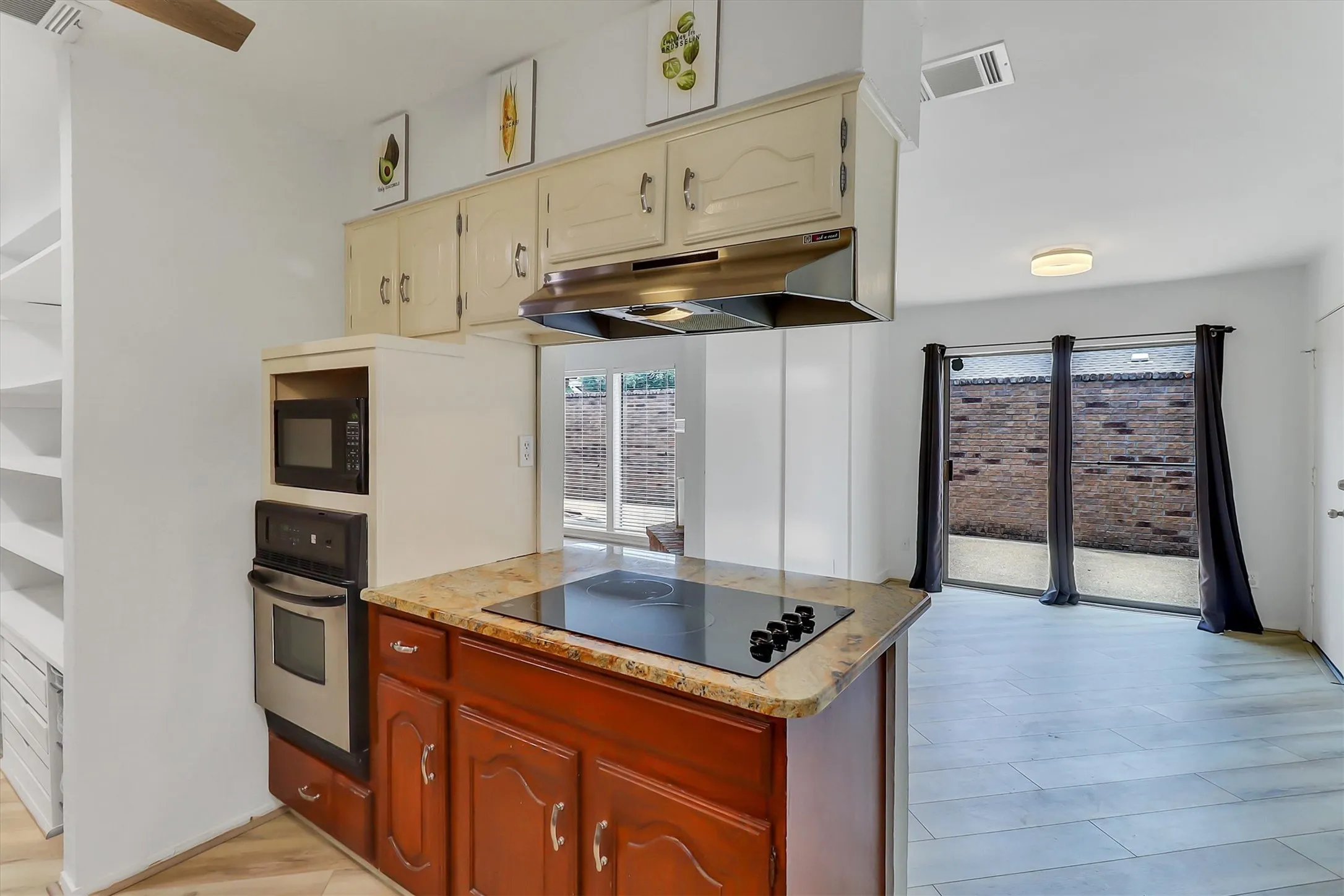 Kitchen overlooks dining room.