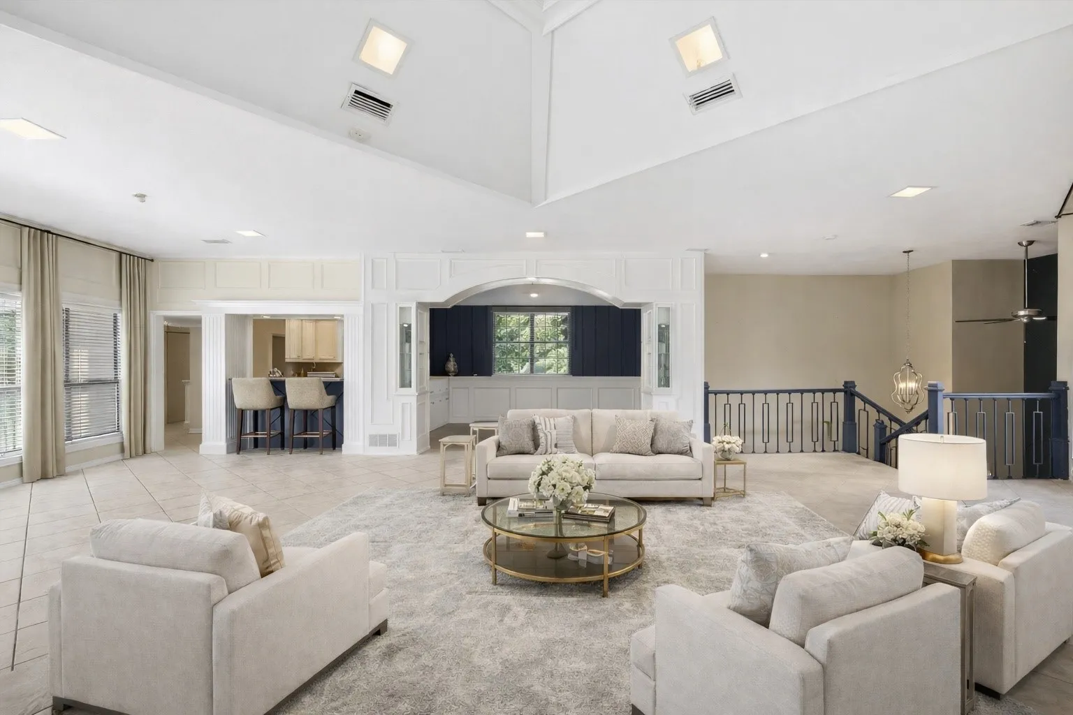 Virtually Staged Vaulted ceiling, recessed lighting, and a built-in wet bar