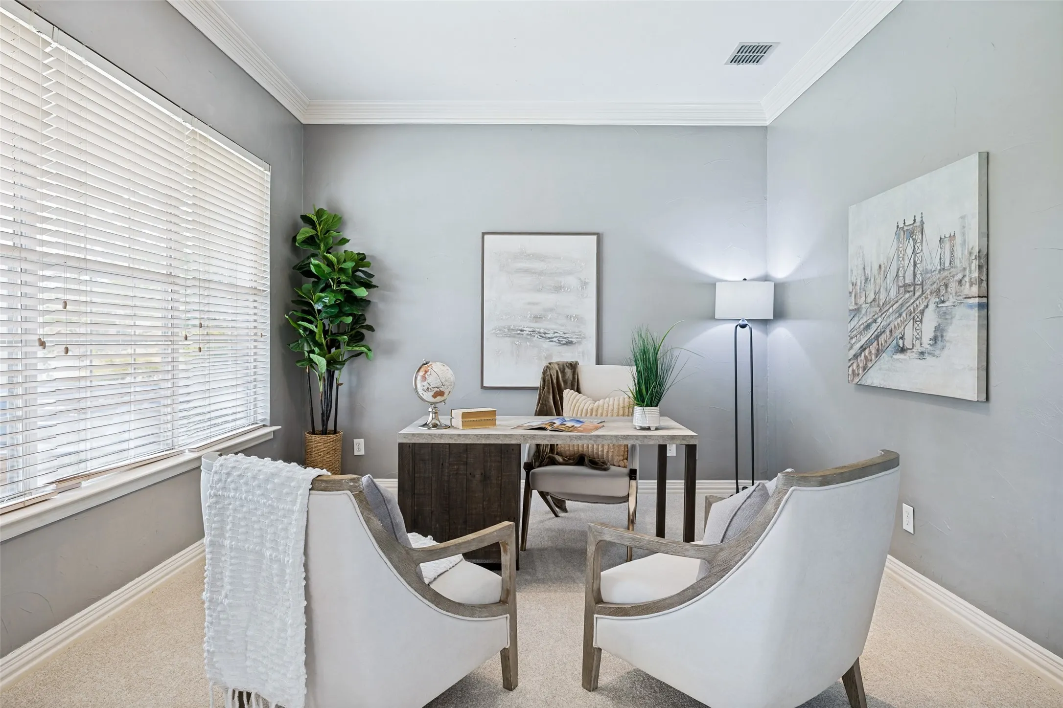 Light gray wall paint, crown molding, double windows with blinds, light-colored carpeting, and recessed lighting