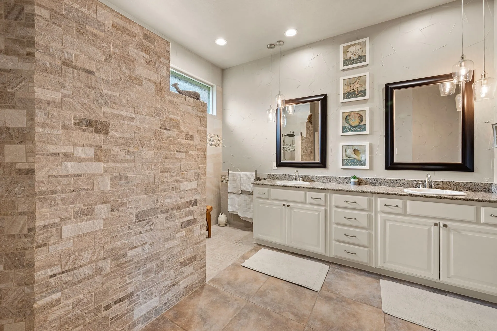 Here you can see the wall mounted towel warmer that is present!