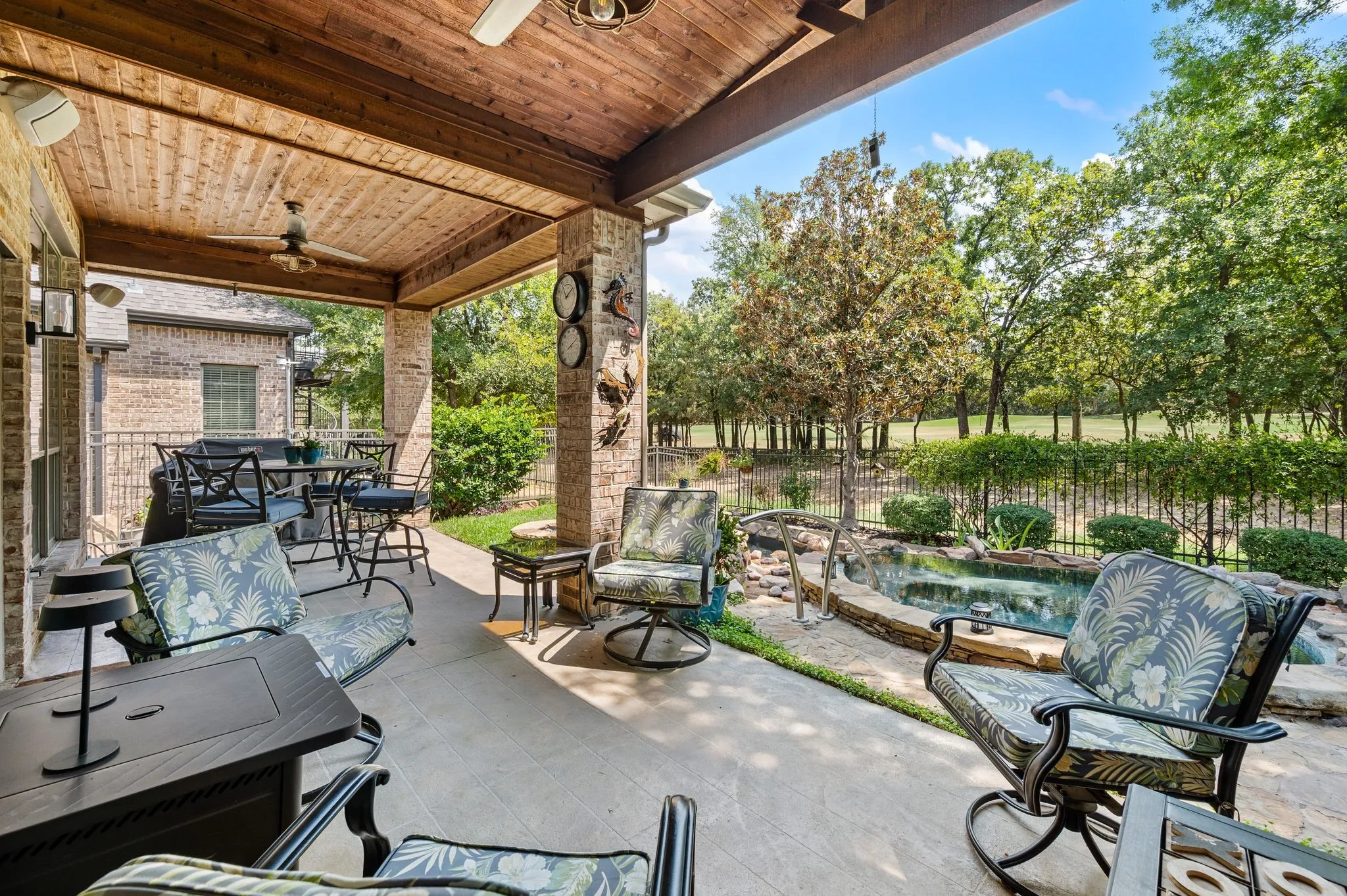 Spacious 10'x26' covered patio offers multiple seating areas, ceiling fans & peaceful golf course views. NOTICE the cedar trimmed ceilings and dual ceiling fans!