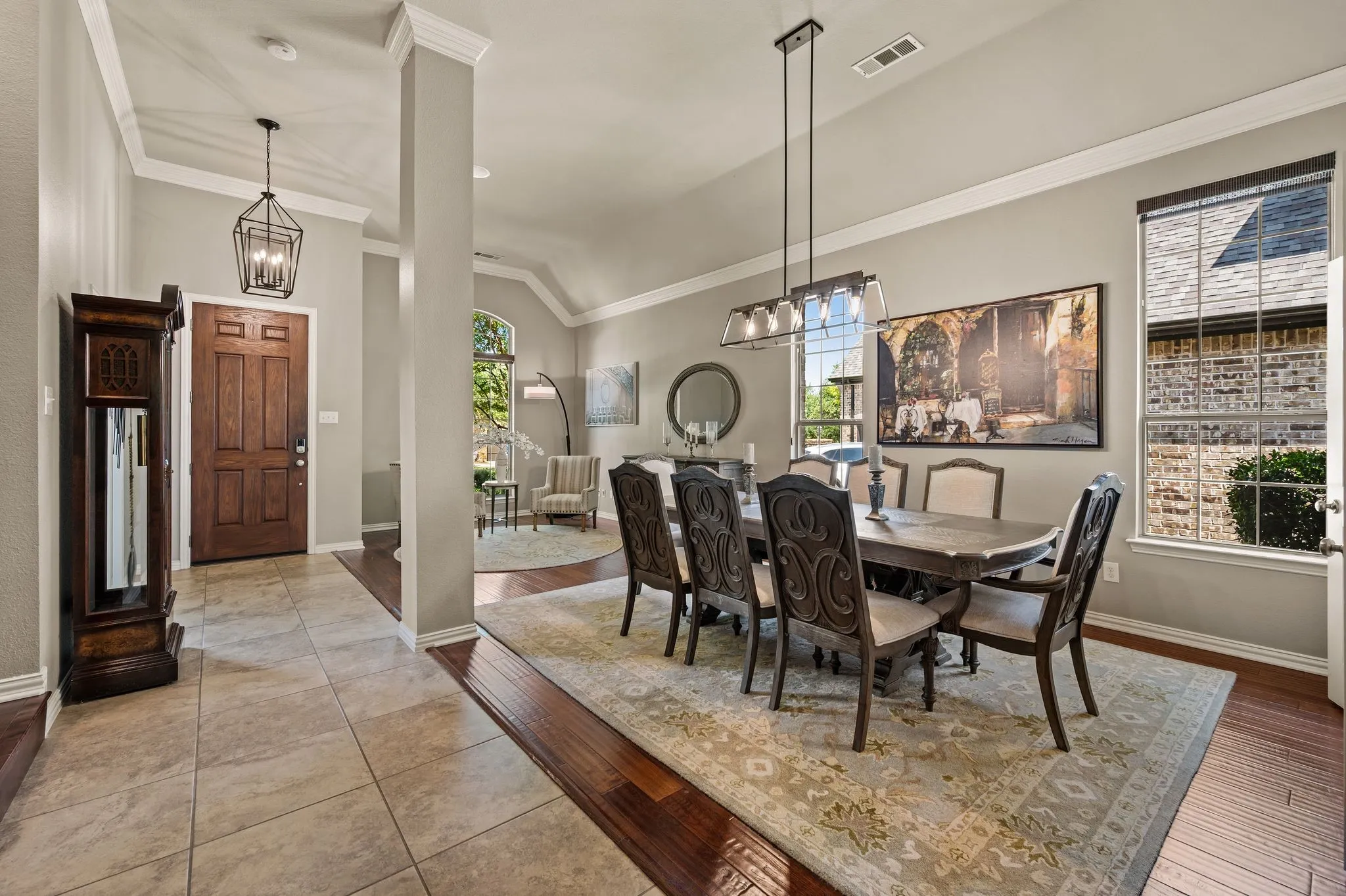 Grand entry opens to tall ceilings, an elegant formal living & dining spaces... all with rich wood floors and in-ceiling speakers to help set the mood!