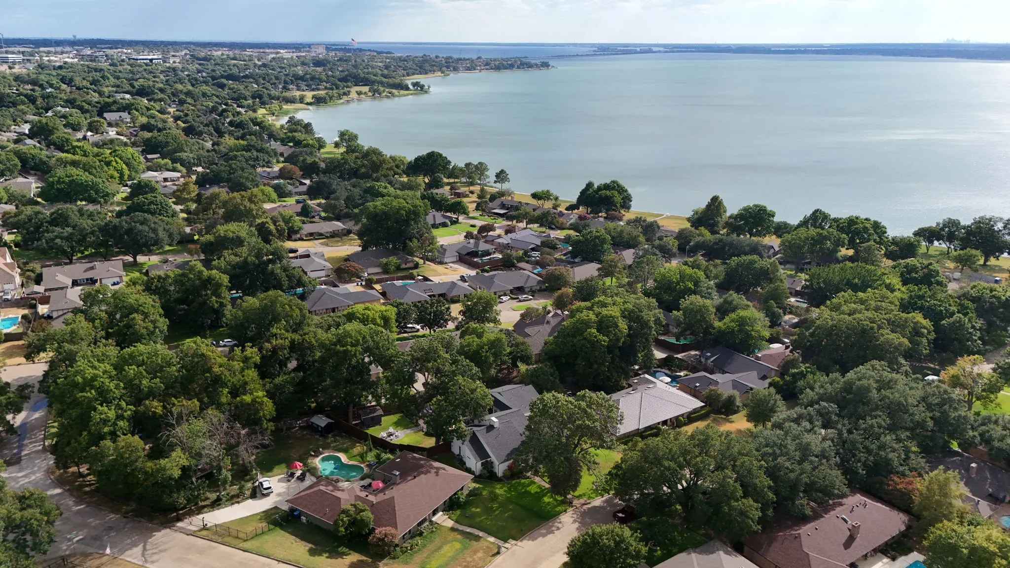 Waterfront residential area with mature tree canopy
