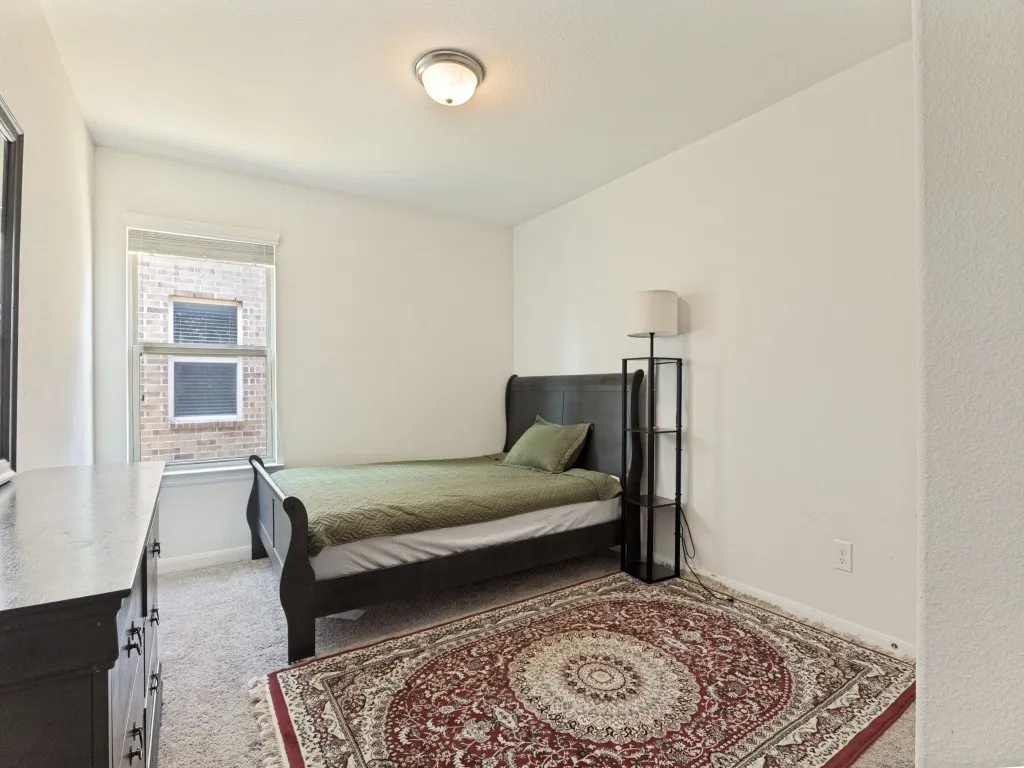 Carpeted flooring, recessed window, and flush mount lighting
