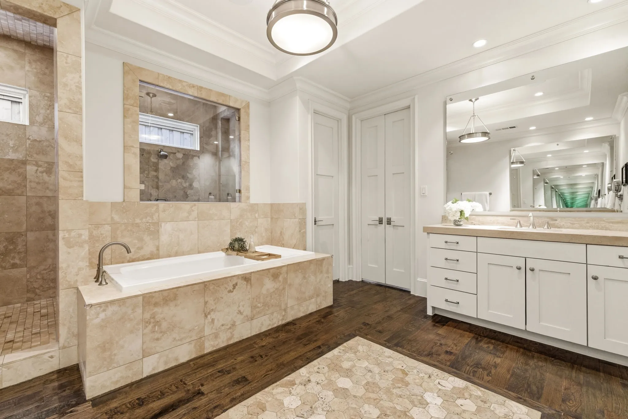 Timeless travertine with separate sink areas.