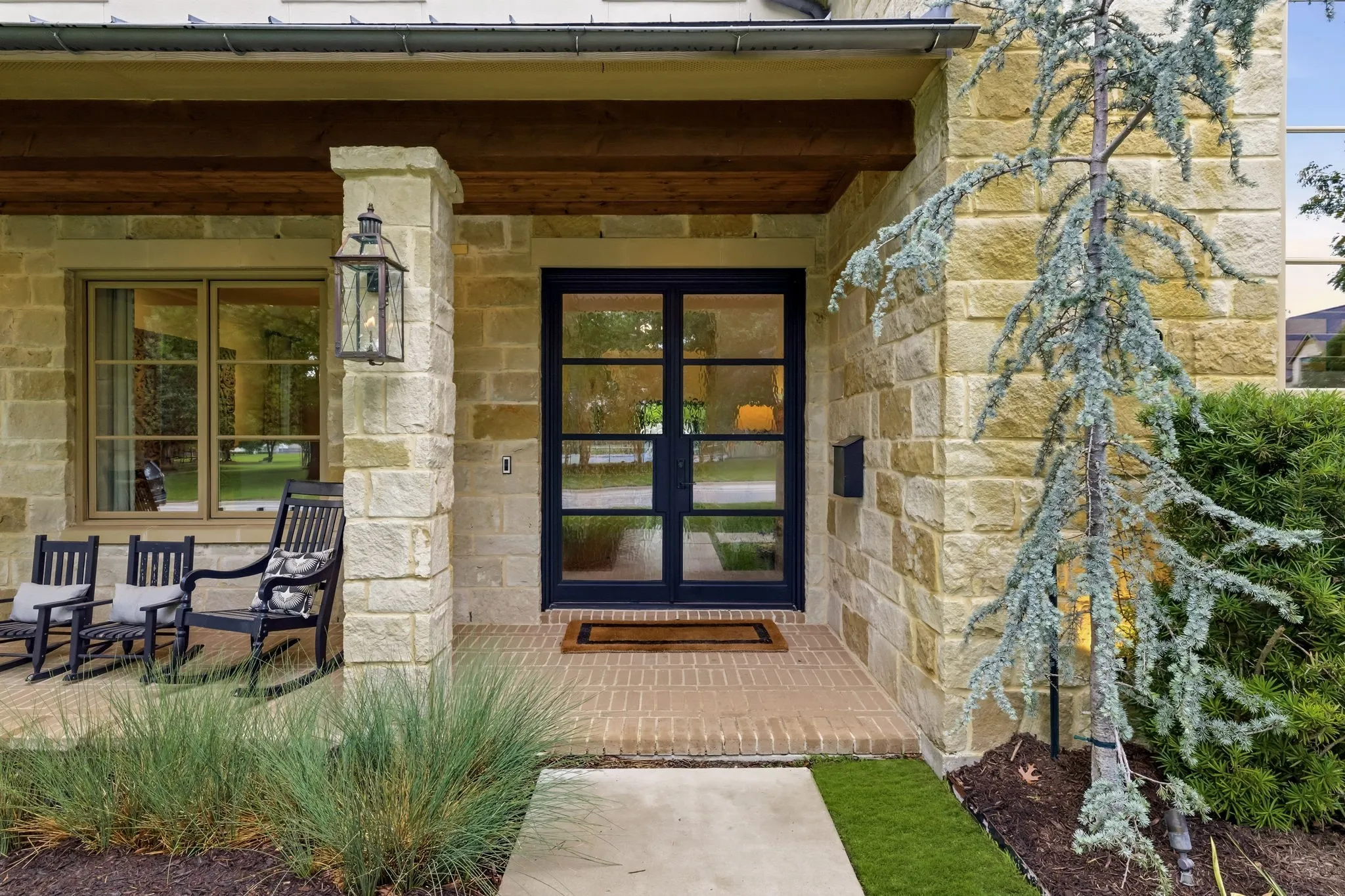 Covered front porch overlooking Preston Hollow Park.