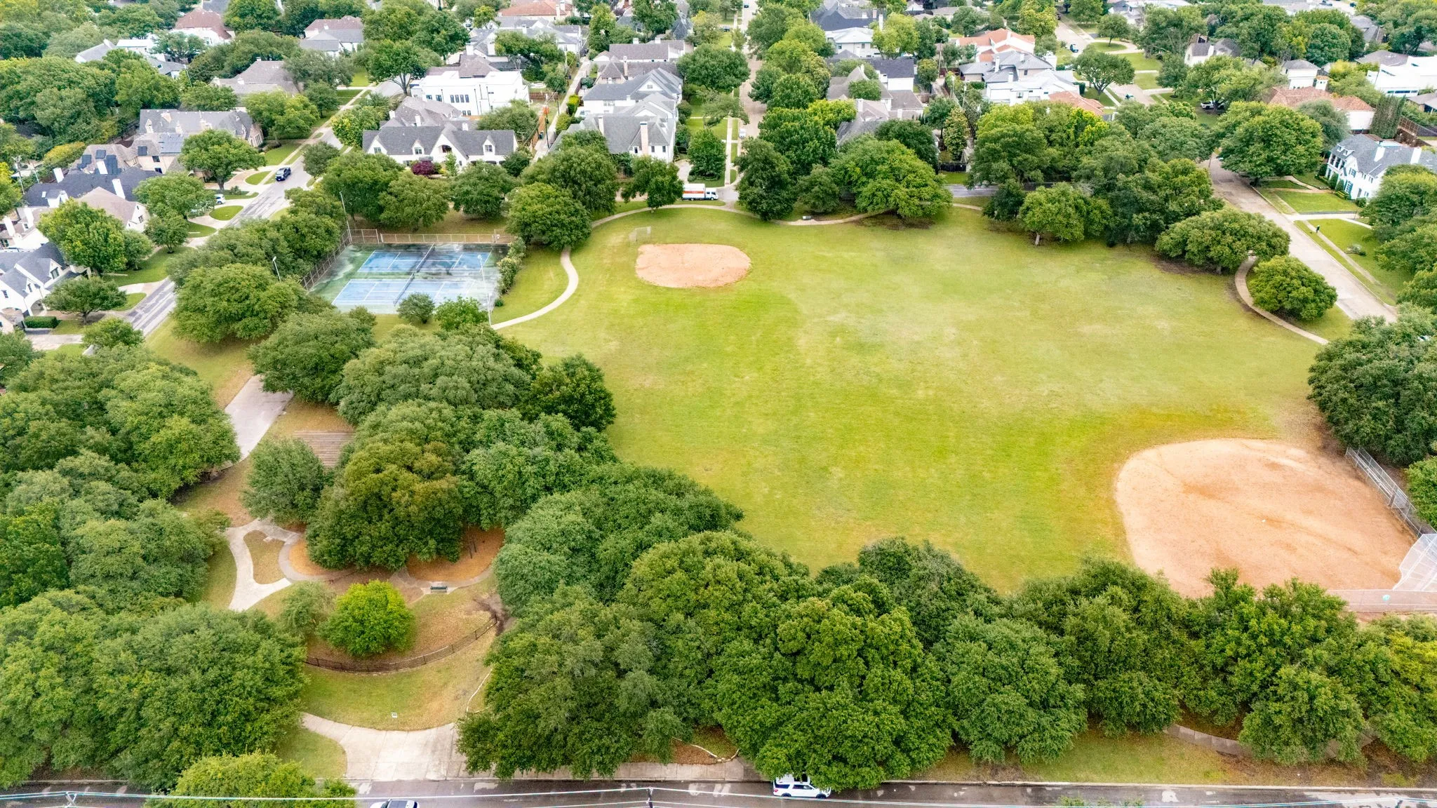 Located directly across from Preston Hollow Park with all of its amenities including, tennis courts, walking/running paths, playground, sports fields and pavilion.