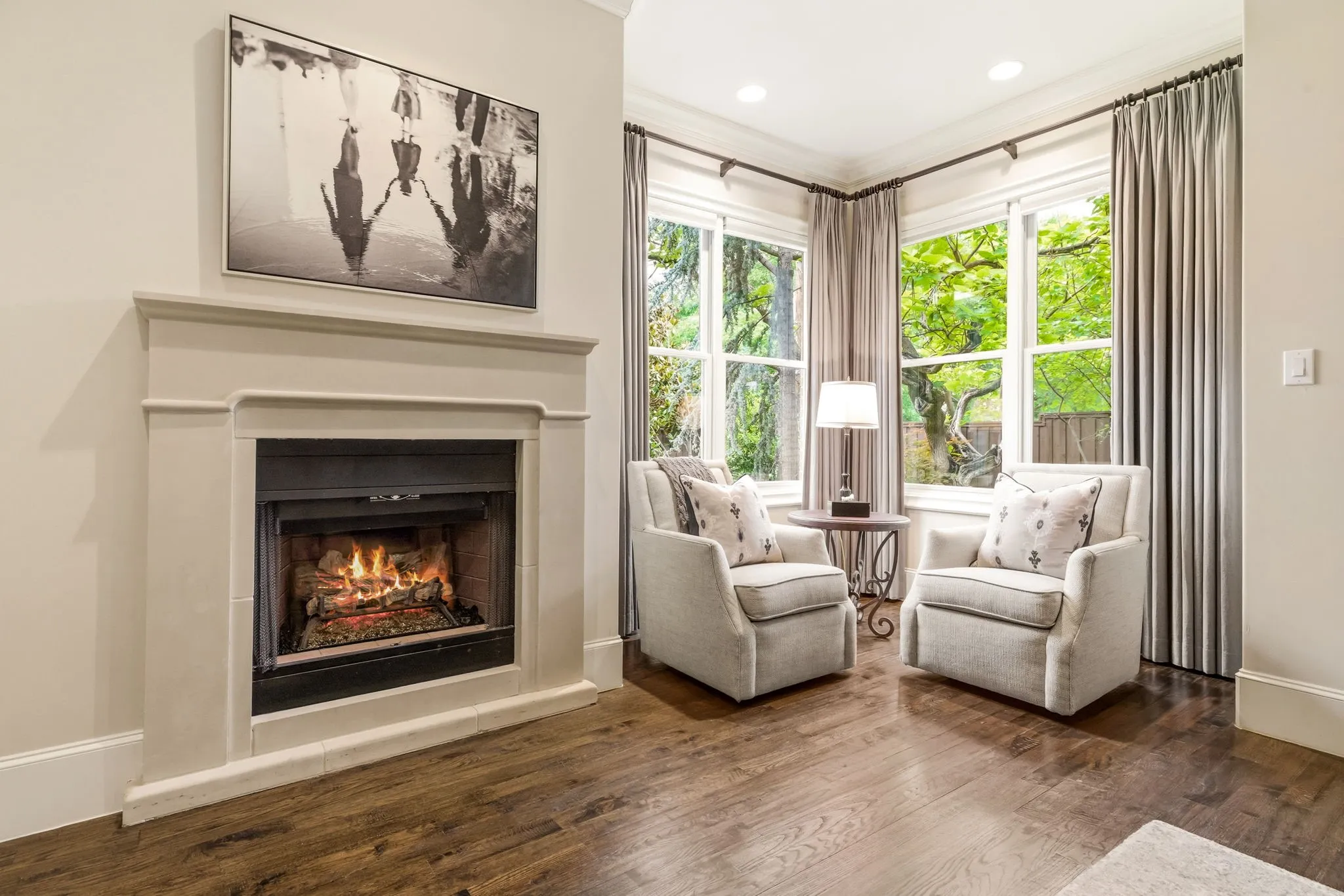 Sitting area and fireplace in primary bedroom on 1st floor.