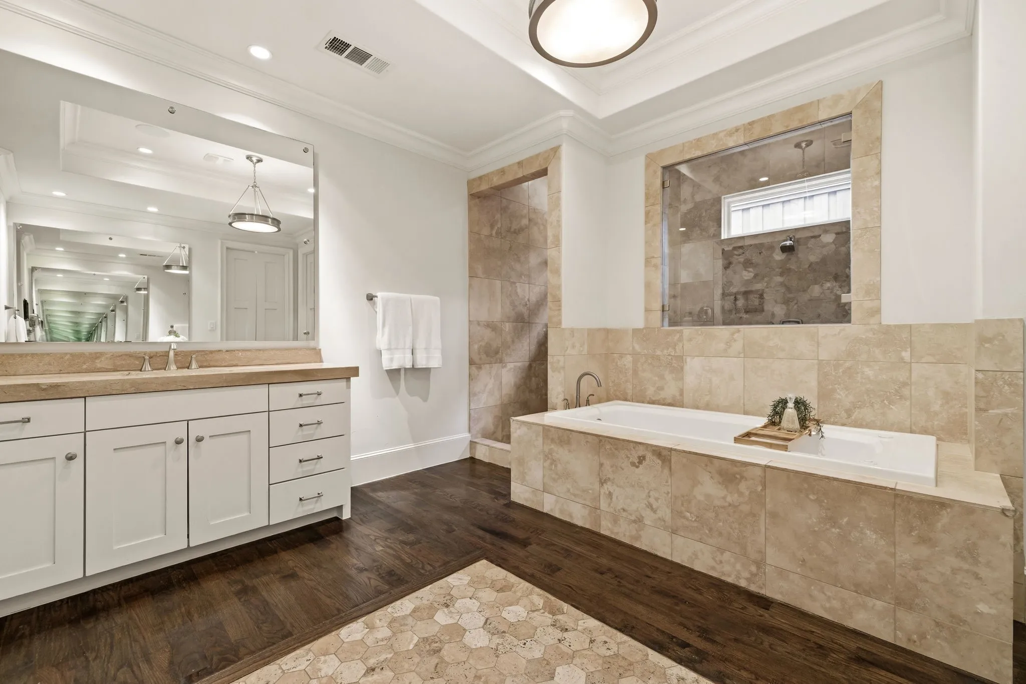 Oversized bathroom leads to larger walk-in closet, and cedar closet with W/D hook ups for 1st floor laundry.